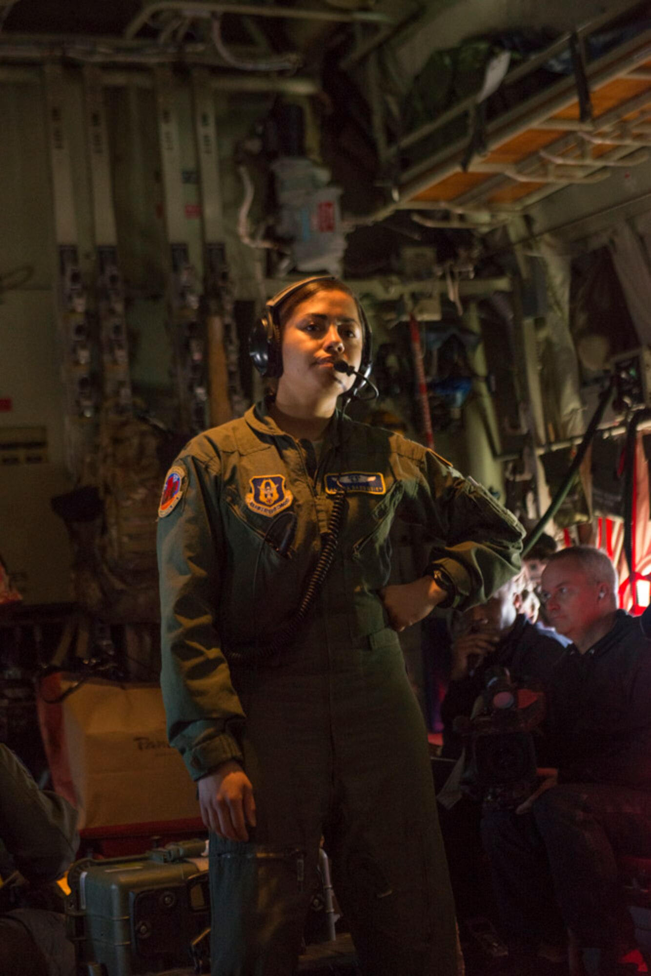 1st Lt. Alyssa Sandquist, a Flight nurse with the 36th Aeromedical Evacuation Squadron, looks over the cabin just after takeoff in a four hour training flight. (Photo by Lewis Perkins/Paraglide)