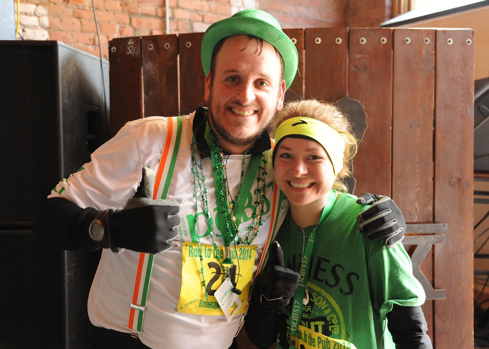 Public Affairs teammates, Josh Aycock, 341st Missile Wing PA chief, and Senior Airman Katrina Heikkinen, 341st MW PA editor, pose for a photo after finishing a half marathon in celebration of St. Patrick’s Day on March 15 in Bozeman, Mont. Although Aycock has participated in several half and full marathons, he helped train Heikkinen for this event – her first half marathon. Heikkinen finished in 1 hour and 54 minutes, followed by Aycock at 1 hour and 58 minutes. (U.S. Air Force photo/Senior Airman Cortney Paxton)