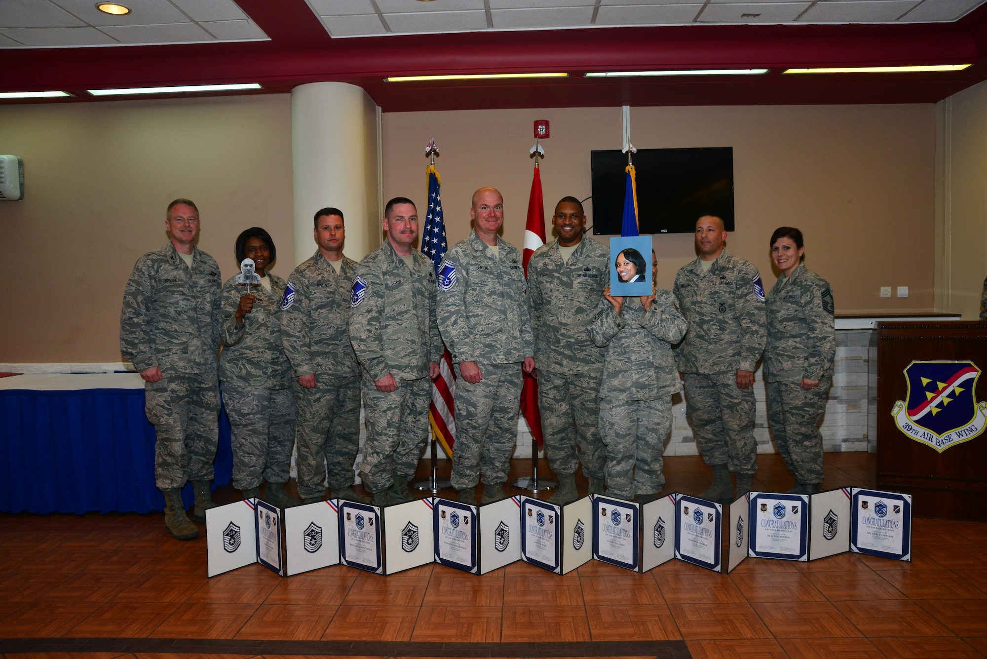 Col. Brent Bigger, 39th Air Base Wing vice commander, and Chief Master Sgt. Lori Gawan, 39th Mission Support Group superintendent, stand with Incirlik’s senior master sergeant selects during the Senior Master Sergeant Release Ceremony March 20, 2014, Incirlik Air Base, Turkey. The eight are among 999 selected from the 14,823 eligible master sergeants. (U.S. Air Force photo by Staff Sgt. Eric Summers Jr./Released.)