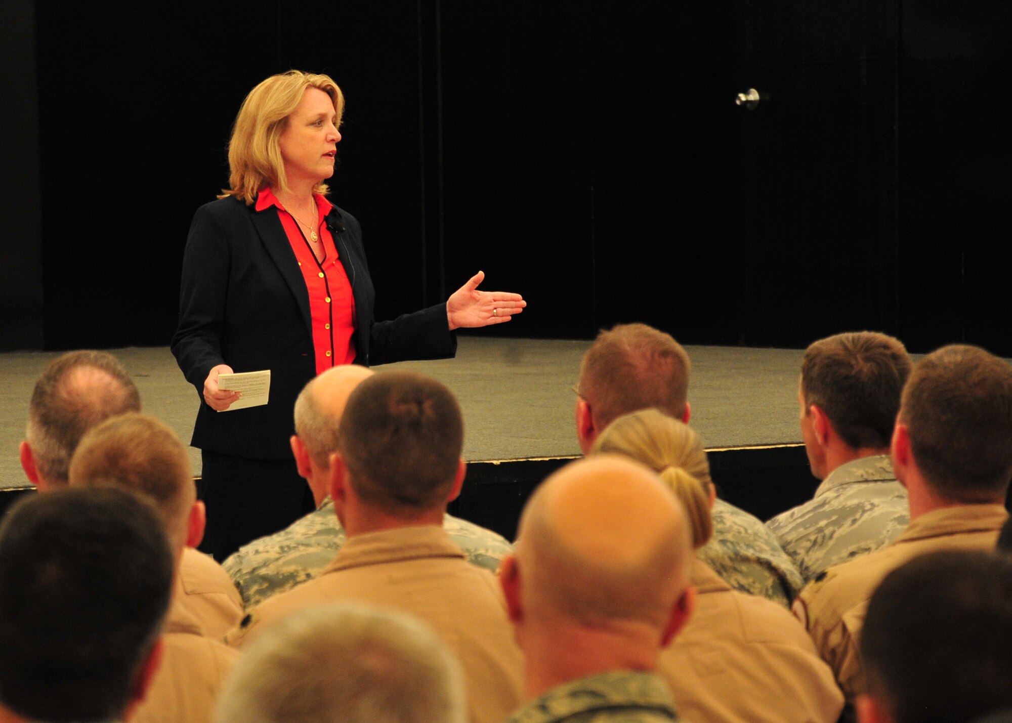 Secretary of the Air Force Deborah Lee James speaks during an Airmen's 
call at the 380th Air Expeditionary Wing at an undisclosed location in
Southwest Asia, March 19, 2014. During the Airmen's call, James spoke to the 
audience about her career history and leadership experience, priorities, 
challenges the Air Force is facing, and core values. (U.S. Air Force photo by Staff Sgt. Michael Means/Released)
