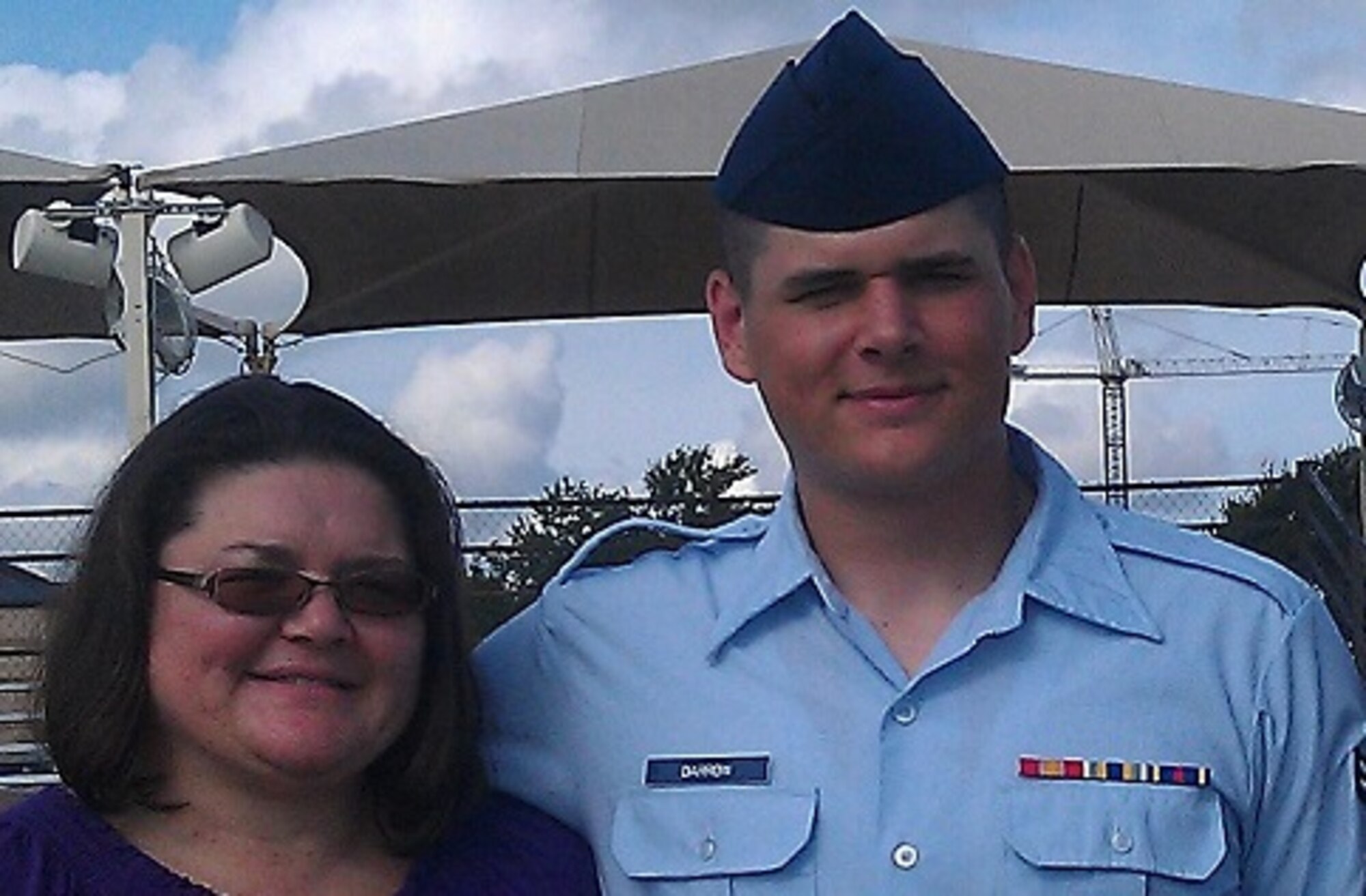 Air Force Airman 1st Class Andrew Darrow, 117th Air Control Squadron radio frequency transmission systems apprentice, poses for a photo with his mother Lisa Darrow after his basic military training graduation at Joint Base San Antonio-Lackland, Texas. (Courtesy Photo) 
