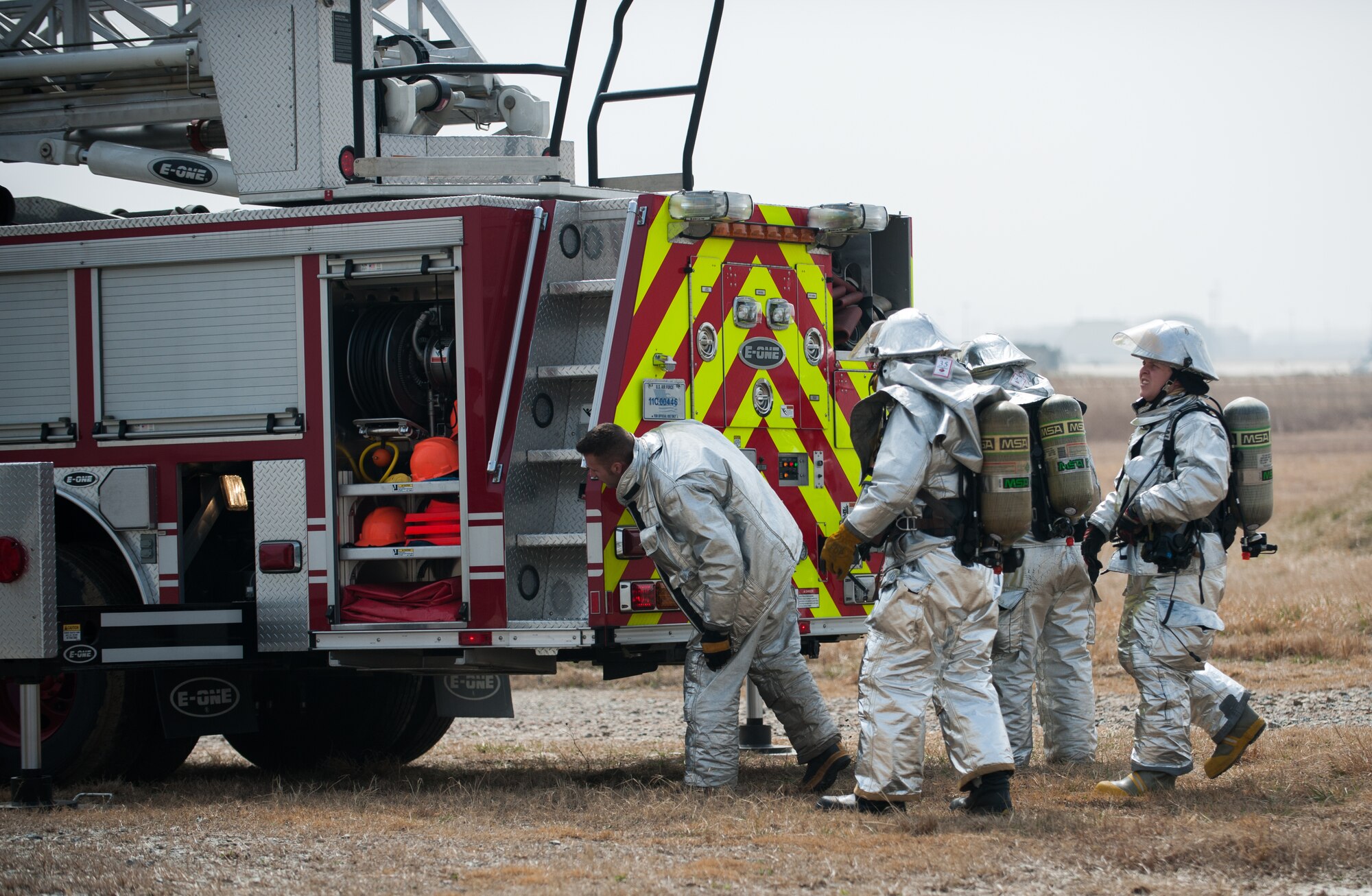 Firefighters from the 8th Civil Engineer Squadron fire department respond to a simulated fire at Kunsan Air Base, Republic of Korea, Mar. 18, 2014. The firefighters conducted classroom and live-fire training with firefighters from Marine Wing Support Squadron 172 and the Republic of Korea air force 38th Fighter Group fire department to enhance teamwork between fire departments. (U.S. Air Force photo by Staff Sgt. Clayton Lenhardt/Released)