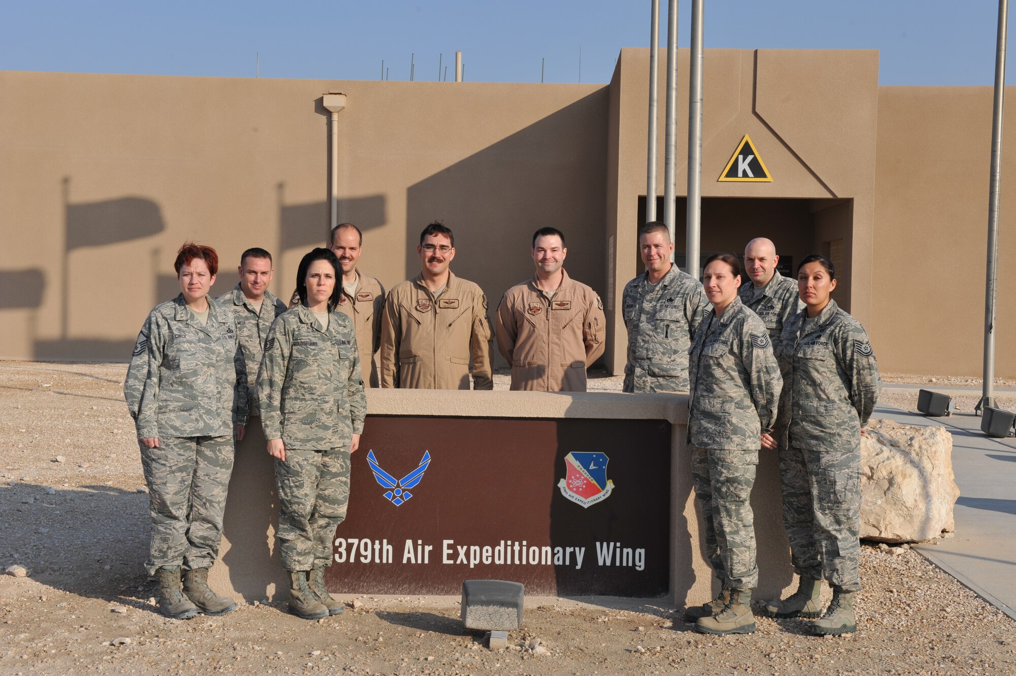 Airmen from the 379th Air Expeditionary Wing Safety Office pose for a group photo Jan. 14, 2014, at Al Udeid Air Base, Qatar. During fiscal year 2013, the Airmen who make up the Safety Office were awarded a total of nine safety awards: two Air Force level awards, four Air Combat Command awards and three Air Forces Central Command awards. 