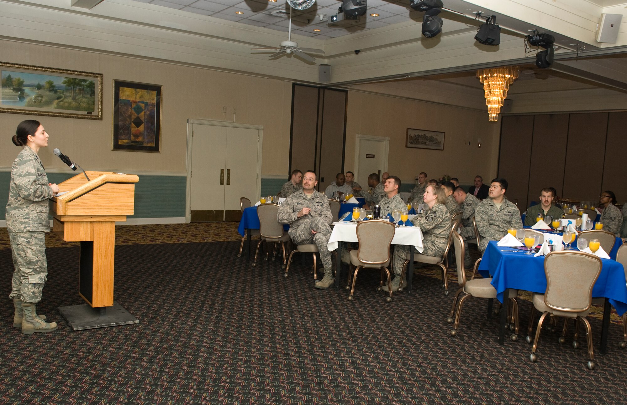 Capt. Vanessa Gonzalez, 8th Communications Squadron director of operations, briefs the Wolf Pack on the Air Force Assistance Fund at Kunsan Air Base, Republic of Korea, Mar. 20, 2014. The AFAF was established to provide an annual effort to raise funds for the charitable affiliates providing support to Air Force families including in need active duty, retirees, reservists, guard and their dependents and surviving spouses. These organizations provide aid in an emergency, educational need or to have secure retirement housing for widows or widowers of Air Force members. (U.S. Air Force photo by Staff Sgt. Jessica Haas/Released)