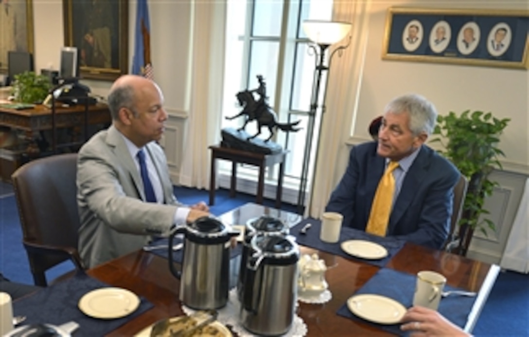 Defense Secretary Chuck Hagel meets with Secretary of Homeland Security Jeh Johnson at the Pentagon, March 21, 2014. The two leaders discussed mutual interests between the two departments. Johnson was the Defense Department's general counsel before his current position.