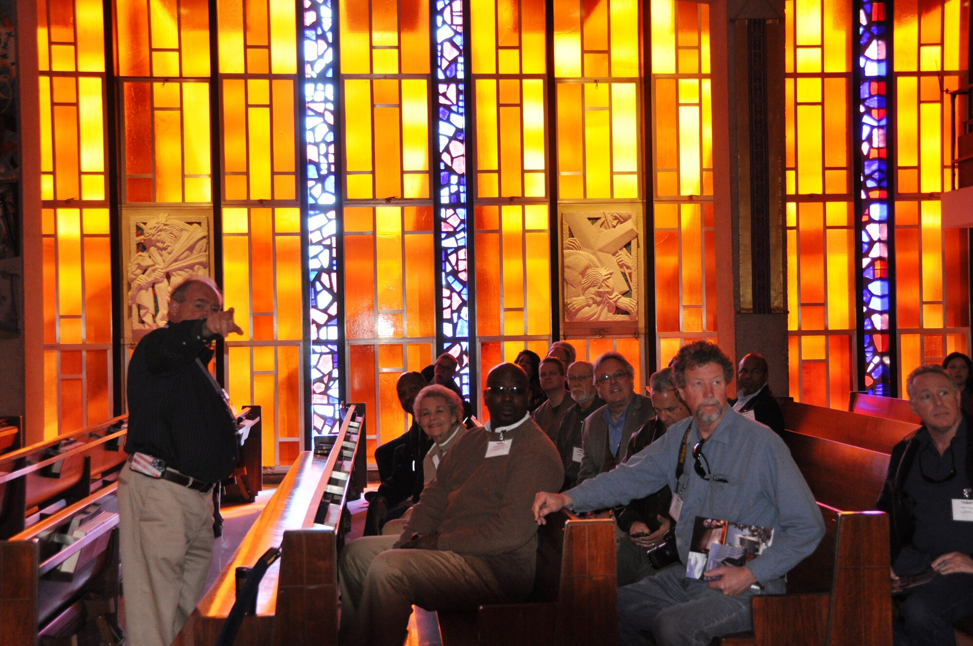 Mark Firks, a U.S. Air Force Academy Chapel guide, explains the symbolism of the art in the Catholic chapel to members of the 433rd Airlift Wing’s Civic Leader Tour on March 21, 2014 during their visit to the Colorado Springs, Colo. area. (U.S. Air Force photo by Tech Sgt. Carlos J. Trevino)