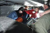 Clay Richmond, President, Pizza Hut of San Antonio No. 11, Inc., and  Lisa O'Briant, manager of Administrative Services for Provenir, are given a tour by Master Sgt. Christopher Norris, an 18th Airlift Squadron boom operator instructor, aboard a KC-135 Statotanker assigned to McConnell Air Force Base, Kan. on March 21, 2014. The 433rd Airlift Wing’s Civic Leaders were flown to Colorado Springs, Colo., by an Air Force Reserve crew assigned to the 931st Air Refueling Group. (U.S. Air Force photo by Tech Sgt. Carlos J. Trevino)