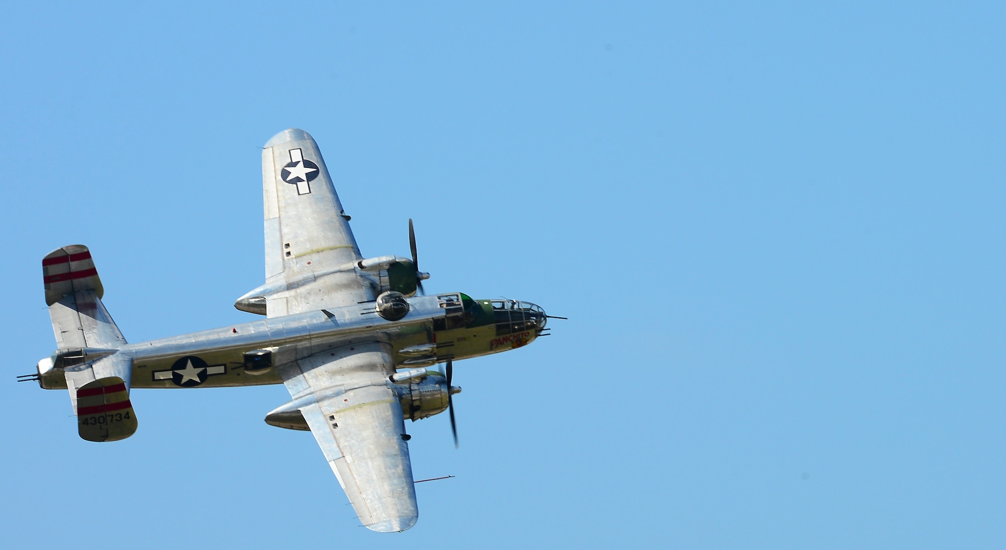 The DAV Flight Team B-25 performs aerobatics during Tampa Bay AirFest 2014 at MacDill Air Force Base, Fla., March 22, 2014. This year’s AirFest was host to spectacular aerial demonstrations, static displays and featured the Air Force Thunderbirds, giving the Tampa Bay community the opportunity to witness firsthand the capabilities of the armed forces. (U.S. Air Force photo by Senior Airman Shandresha Mitchell/Released)