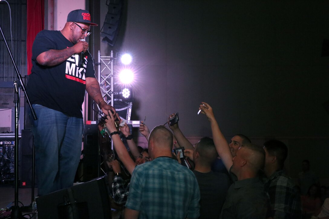 DJ Mike Saunders prepares to give away prizes during the Leatherneck Comedy Tour show at the Combat Center base theater, Mach 14, 2014 The show featured comedians Byron Bowers, Jim McCue and Ben Gleib, as well as a musical performance by Eve 6.