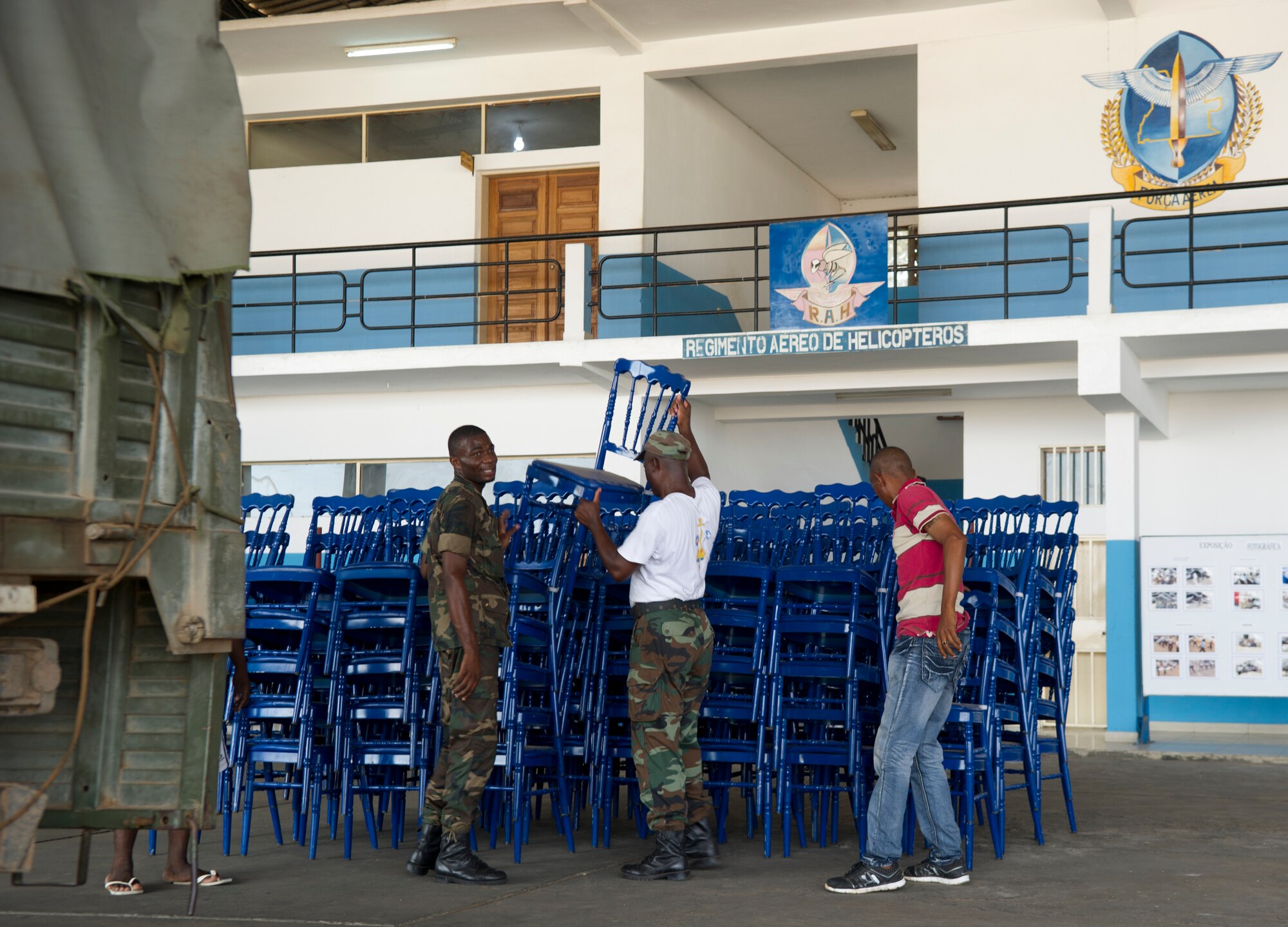 Angolan air force airmen unload chairs from a truck in preparation for African Partnership Flight at Luanda Air Base, Angola, March 22, 2014. More than 20 U.S. Air Force airmen arrived to participate in African Partnership Flight with the Angolan and Zambian air forces, an event which provides a collaborative learning environment for the airmen. (U.S. Air Force photo/Tech. Sgt. Benjamin Wilson)