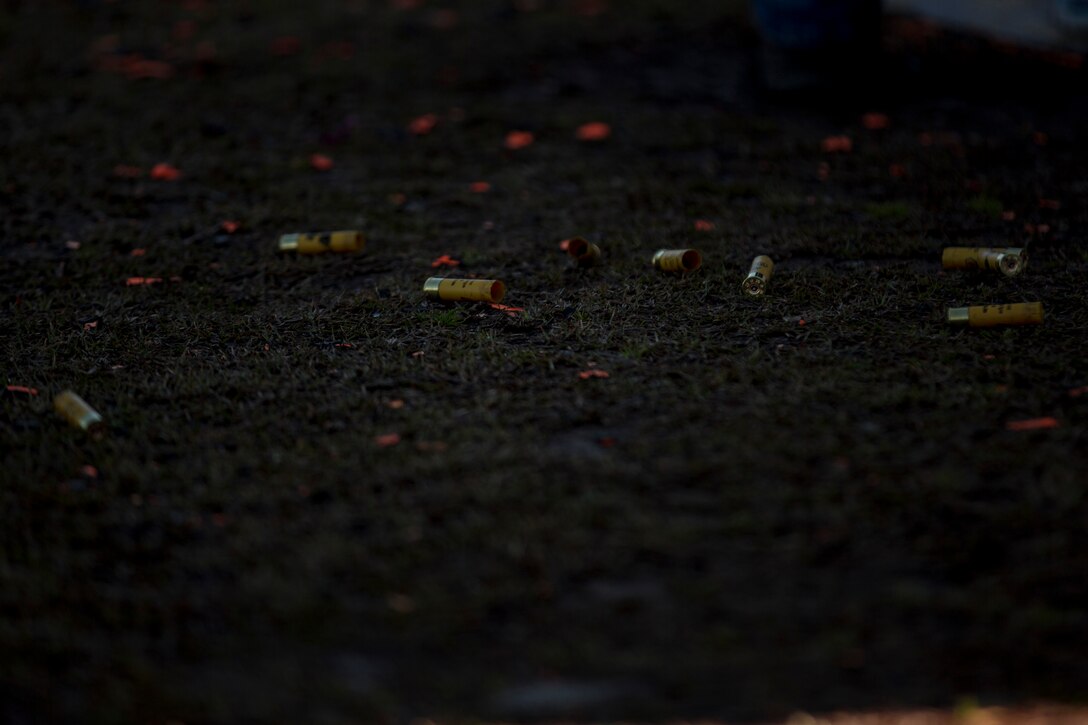.20 gauge shells and broken bits of clay are strewn across the McIntyre Shooting Complex aboard Camp Lejeune, N.C., March 21, 2014.  Spouses with 2nd Dental Battalion, 2nd Marine Logistics Group, II Marine Expeditionary Force, fired shotguns and archery during a spouse meet and greet.  (U.S. Marine Corps photo by Lance Cpl. Shawn Valosin)