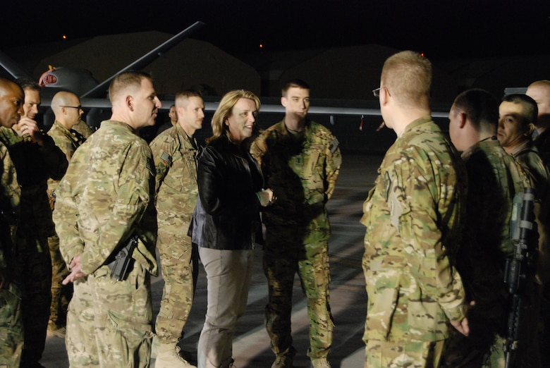 Secretary of the Air Force Deborah Lee James talks with Airmen from the 451st Air Expeditionary Group during a stop at a static display on the flightline March 20, 2014, at Kandahar Airfield, Afghanistan. James received a short briefing about each aircraft and held a question and answer session after the briefings. (U.S. Air Force photo by Capt. Brian Wagner)