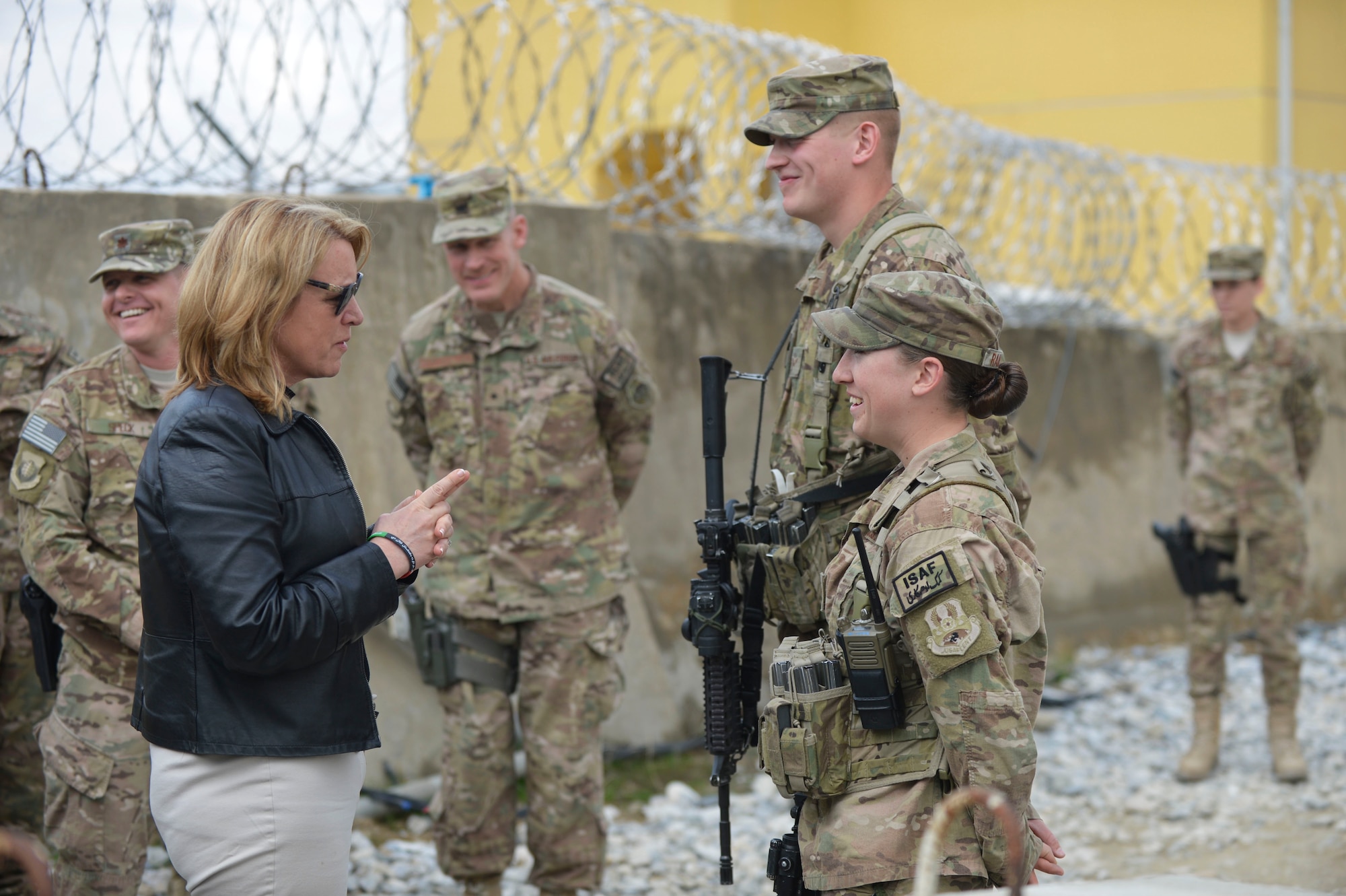 Deborah Lee James, Secretary of the Air Force, talks to Airman 1st Class Nathaniel Ripp and Airman 1st Class Kaitlyn Ramstead after receiving a post briefing from the Security Forces defenders at Bagram Airfield, Afghanistan, March 22, 2014. Ripp and Ramstead were providing security for a venue that James was speaking at during her first official visit to Afghanistan.(U.S. Air Force photo by Senior Master Sgt. Gary J. Rihn)