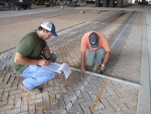 Results are logged during recent face brick tests at ERDC. The tests showed face bricks in controlled environmental conditions are capable of withstanding low-volume truck loads of approximately 54,000 pounds.