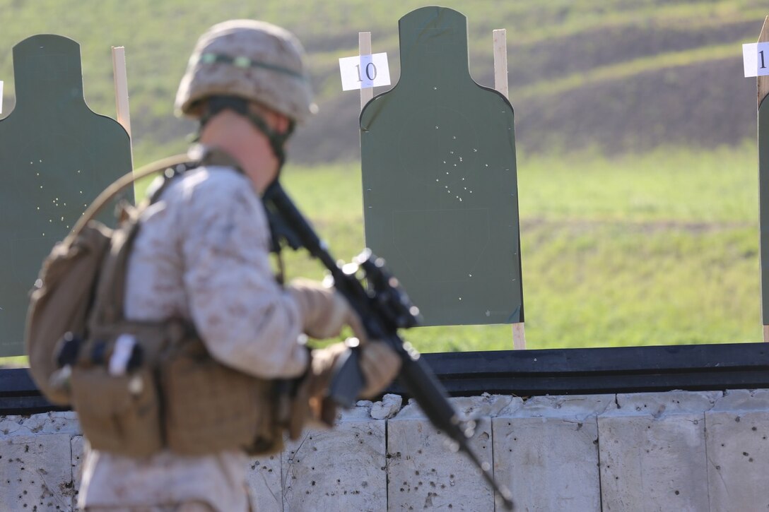 A Marine squares off to his target during a pivoting drill as part of annual rifle qualification aboard Camp Pendleton Calif., March 19.  Marines from the 1st Intelligence Battalion conducted firearm training aboard Camp Pendleton Calif., March 19.