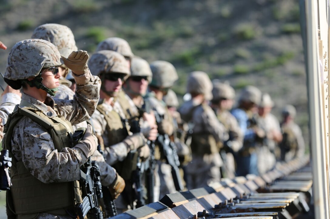 Marines assess their shot placement during annual rifle qualification.  Marines from the 1st Intelligence Battalion conducted firearm training aboard Camp Pendleton Calif., March 19.