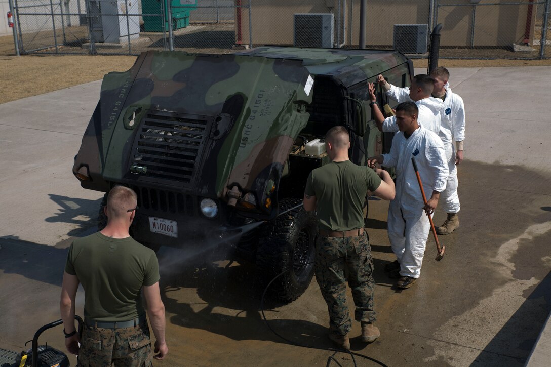 U.S. Marines clean a Humvee March 17 at Camp Mujuk in Pohang, Republic of Korea. The Humvee’s are used in support of Marine Expeditionary Force Exercise 2014. The ROK and U.S. combined ability to operate across the range of military operations from disaster relief to complex expeditionary operations contributes to the security and stability on the Korean Peninsula as well as the entire Asia-Pacific. The U.S. Marines are with various units under III MEF. 
