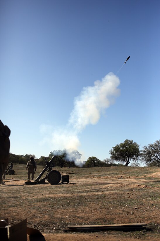 Marines with Charlie Battery, Battalion Landing Team 2nd Battalion, 1st Marines (BLT 2/1), 11th Marine Expeditionary Unit, fire the M327 120 mm towed mortar system as part of a fire mission during Realistic Urban Training Marine Expeditionary Unit Exercise (RUTMEUEX) 14-1 at Camp Roberts, Calif., March 23, 2014.  RUTMEUEX will prepare the 11th MEU Marines for their upcoming deployment, enhancing Marines' combat skills in environments similar to those they may find in future missions.  (U.S. Marine Corps photo by Lance Cpl. Evan R. White/Released)
