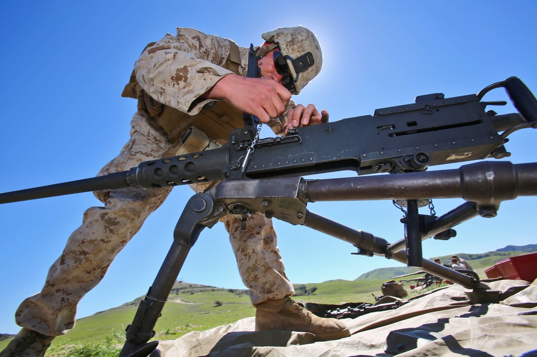 A Marine with Alpha Company, 7th Engineer Support Battalion, 1st Marine Logistics Group, assembles an M240B machine gun during a super squad competition aboard Camp Pendleton, Calif., March 10, 2014. Eight squads, of approximately 80 Marines and sailors, from Alpha Company participated in the weeklong competition that focused on infantry rifle squad skills, tested small-unit leadership and their combat-readiness. (U.S. Marine Corps photo by Cpl. Timothy Childers / Released)