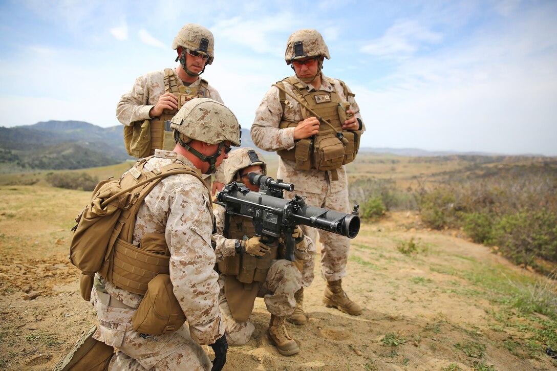 Marines with Alpha Company, 7th Engineer Support Battalion, 1st Marine Logistics Group, prepare to fire a spotting round from a Shoulder-launched Multipurpose Assault Weapon during a live-fire range and competition aboard Camp Pendleton, Calif., March 11, 2014. Eight squads, of approximately 80 Marines and sailors, from Alpha Company participated in the weeklong competition that focused on infantry rifle squad skills, tested small-unit leadership and their combat-readiness. (U.S. Marine Corps photo by Cpl. Timothy Childers / Released)