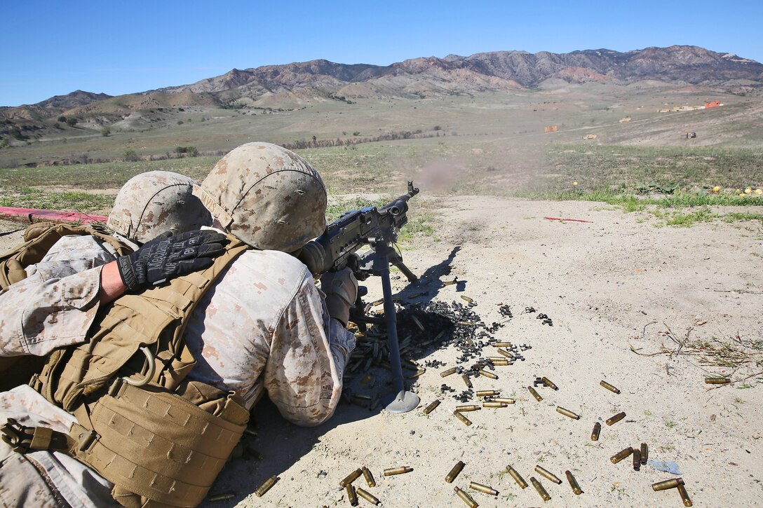 Marines with Alpha Company, 7th Engineer Support Battalion, 1st Marine Logistics Group, fire an M240B machine gun during a super squad competition aboard Camp Pendleton, Calif., March 10, 2014. Eight squads, of approximately 80 Marines and sailors, from Alpha Company participated in the weeklong competition that focused on infantry rifle squad skills, tested small-unit leadership and their combat-readiness. (U.S. Marine Corps photo by Cpl. Timothy Childers / Released)