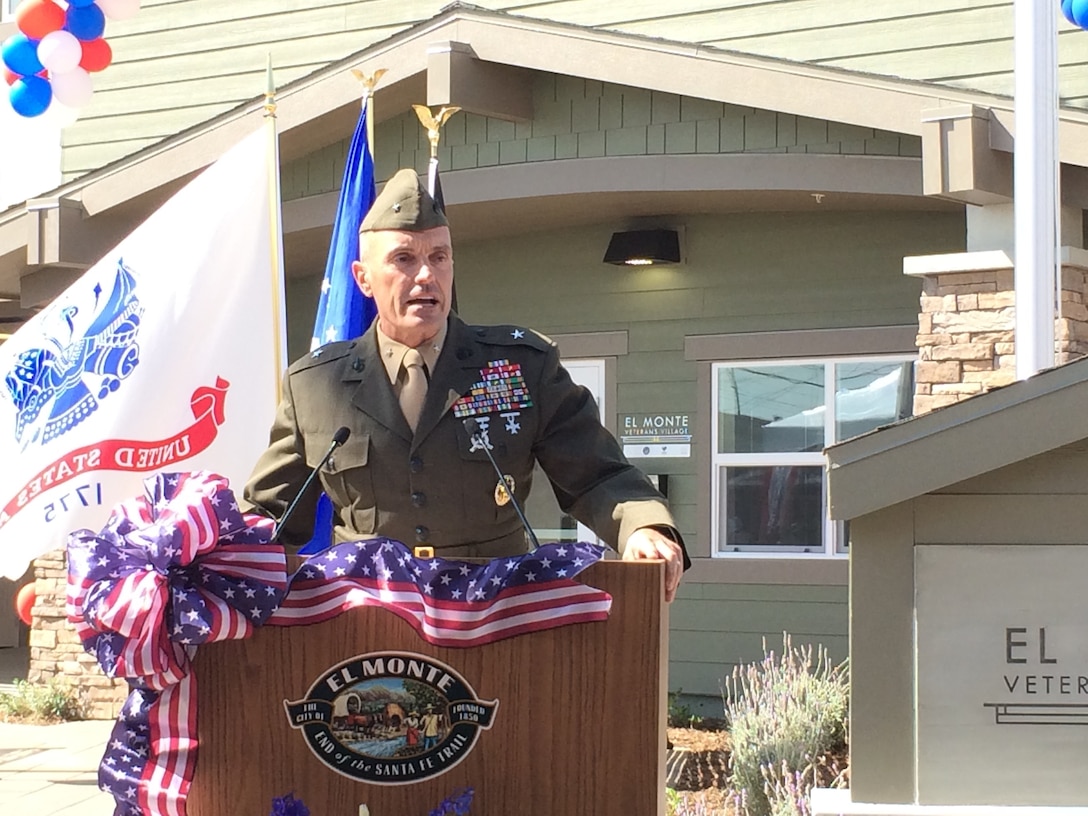 Brigadier Gen. Vincent A. Coglianese, 1st Marine Logistics Group Commanding General, addresses veterans, active duty, elected officials and guests during the grand opening ceremony of the El Monte Veterans Village in El Monte, Calif. on March 12, 2014. Officials with the city of El Monte hosted a grand opening celebration for the first affordable housing community specifically for homeless veterans. The $12 million project includes 40 furnished studio apartments with private balconies. It also includes community-gathering spaces — a community room with a kitchen and lounge area, a computer center, on-site laundry facility, energy efficient design and appliances, community garden, barbecue area and an outdoor stone fireplace. 