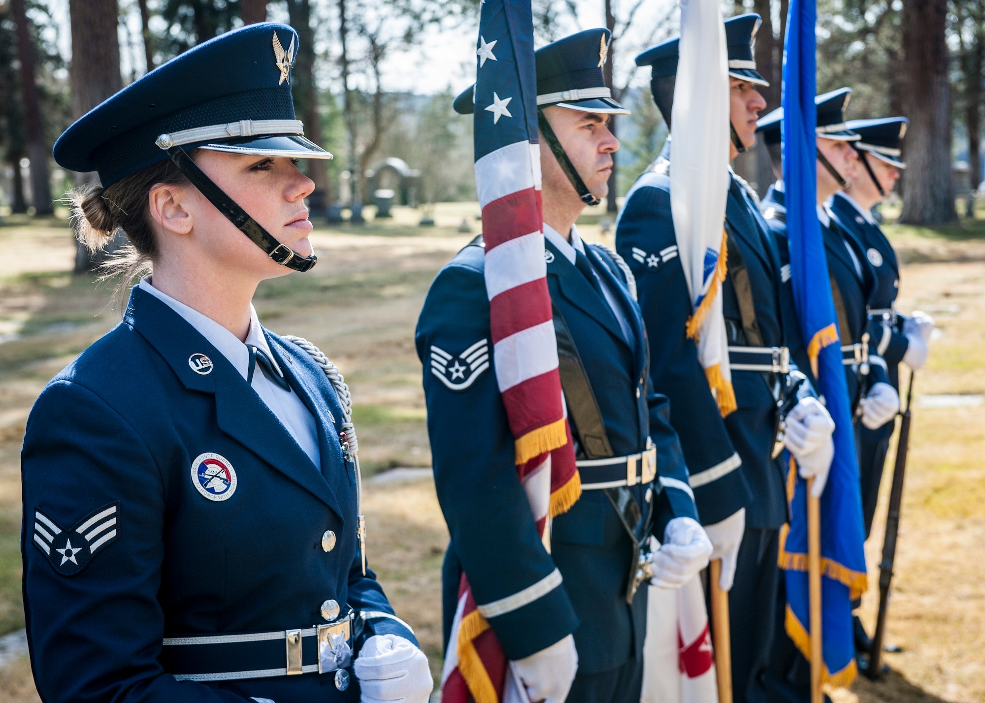 Members of the Fairchild Air Force Base Honor Guard stand at parade rest in preparation for a funeral service honoring Cpl. Lester Zornes at Fairmount Memorial Park in Spokane, Wash., March 22, 2014. Zornes was flying to England to prepare 82nd Airborne paratroopers for dropping behind enemy lines at Normandy on D-Day. Due to weather instability over the North Atlantic, the aircraft and crew diverted to the alternate route over the South Atlantic when the starboard engine on their C-47 Skytrain gave out crashing and immediately bursting into flames on March 22, 1944. Zornes was 19 with a career in Foreign Service that lasted just 11 days. (U.S. Air Force photo by Staff Sgt. Benjamin W. Stratton/Released)