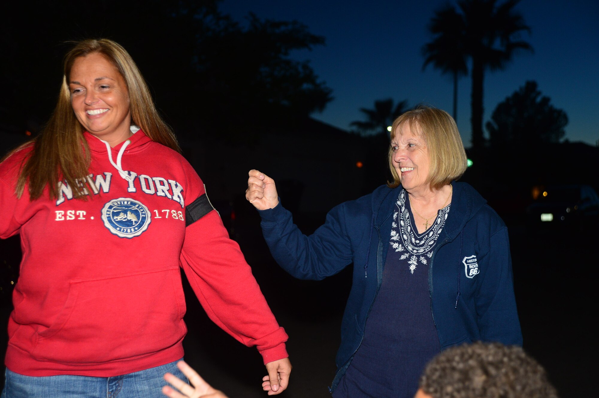 Master Sgt. Dawn, 432nd Operations Support Squadron, has her senior master sergeant stripes tacked on by her mother after being surprised by leadership from the 432nd Wing/432nd Air Expeditionary Wing at their home. Dawn recently arrived at Creech Air Force Base, Nev., and was touched by the leadership’s efforts to immediately include her in Team Creech’s family. (U.S. Air Force photo by Staff Sgt. N.B.)