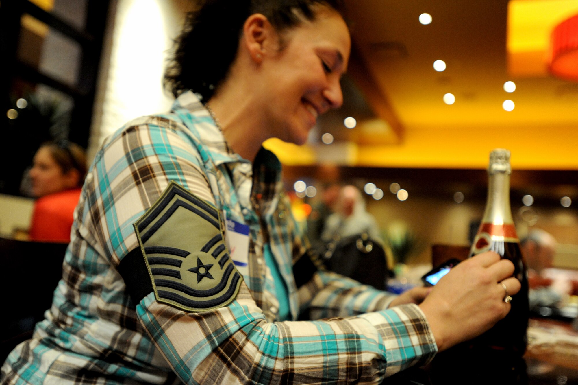 Tammy, wife of Master Sgt. Jody, 432nd Aircraft Maintenance Squadron assistant aircraft maintenance unit superintendent, sends her husband pictures after being told by 432nd Wing/432nd Air Expeditionary Wing leadership of his selection for senior master sergeant during a deployed family dinner at the Aliante Hotel. Leadership from the 432nd Wing traveled to the homes of Creech Air Force Base’s selectees to personally congratulate them and their families on their selection for promotion. (U.S. Air Force photo by Senior Master Sgt. C.R.)