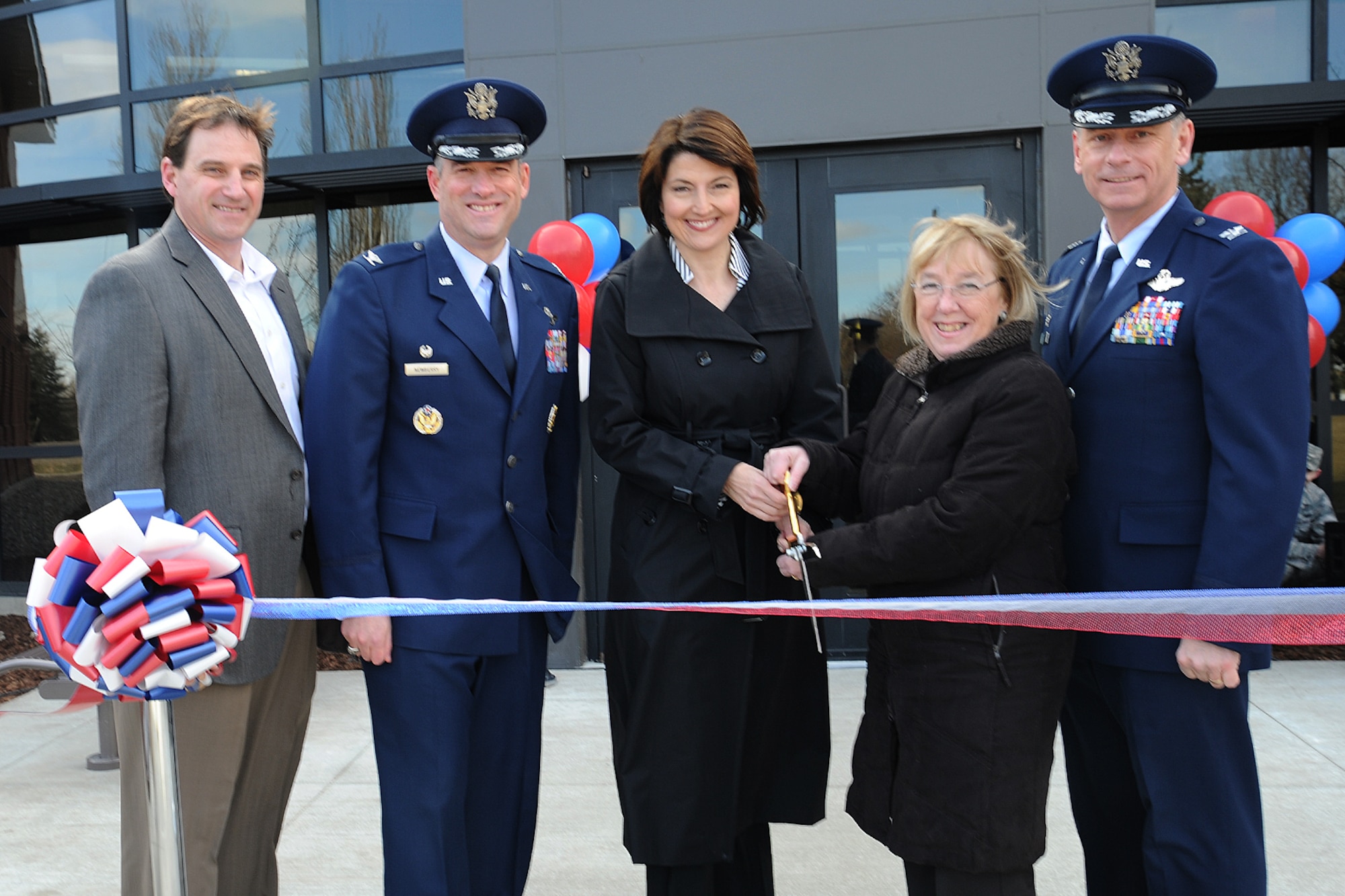 Doug Jackson, Jackson Construction Group president, Col. Brian Newberry, the 92nd Air Refueling Wing commander, U.S. Rep. Cathy McMorris Rodgers, U.S. Sen. Patty Murray and Col. Daniel Swain, the 141st ARW commander, pose for a photo during the ribbon cutting ceremony for the new headquarters building at Fairchild Air Force Base, Wash., March 20, 2014. The ribbon cutting signifies the opening of a new chapter for generations of Airmen to come. (U.S. Air Force photo by Airman 1st Class Janelle Patiño/Released)