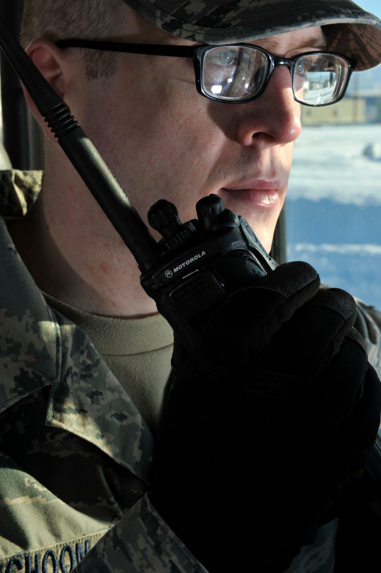 Senior Airman Andrew Schoon, 773d Logistics Readiness Squadron vehicle operator/dispatcher, uses a radio to communicate with other tractor drivers on Joint Base Elmendorf-Richardson, Alaska, March 20, 2014. Tops in Blue accepted Schoon to be a part of their staff for this year’s tour that will last for 10 months. Tops in Blue training is 60 days long, located at Joint Base San Antonio. (U.S. Air Force photo/Airman 1st Class Tammie Ramsouer)