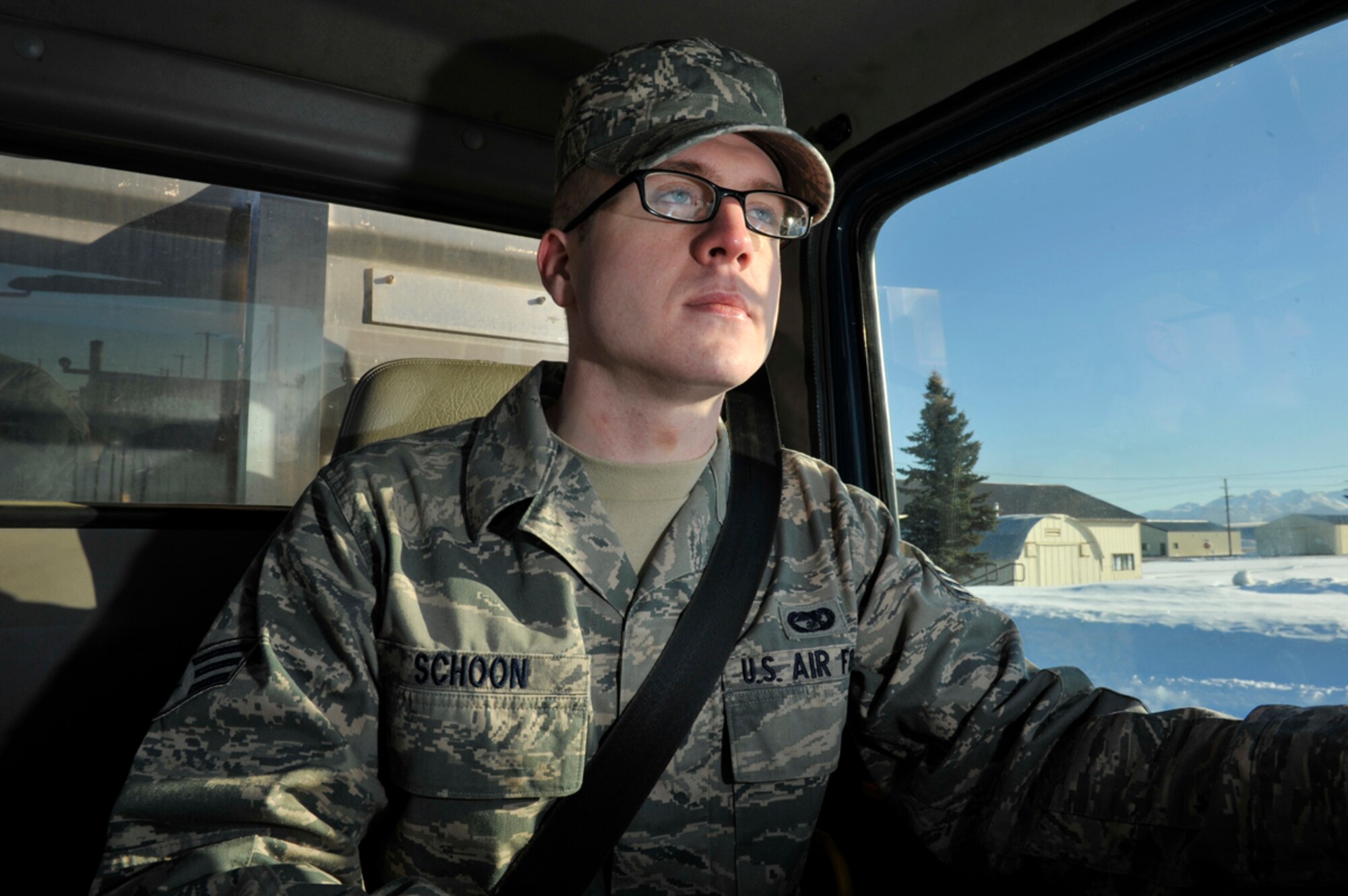 Senior Airman Andrew Schoon drives a seven-and-a-half-ton tractor on Joint Base Elmendorf-Richardson, Alaska, March 20, 2014. Schoon is a vehicle operator/dispatcher for the 773d Logistics Readiness Squadron and selected to be part of the Tops in Blue crew. TIB is an active-duty Air Force special duty assignment for military members to perform their musical talents around the world and raise morale. (U.S. Air Force photo/Airman 1st Class Tammie Ramsouer)