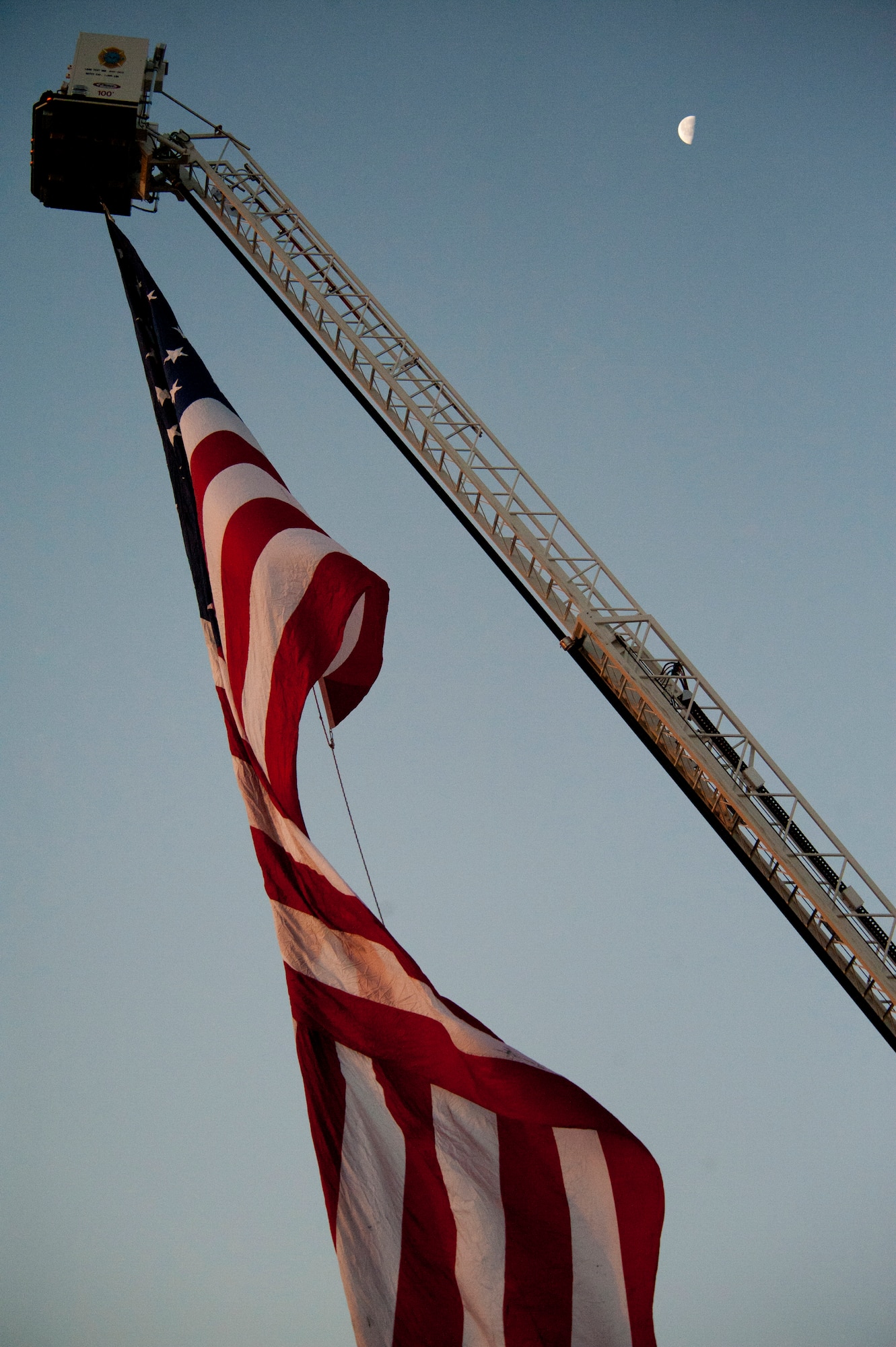 A U.S. flag is raised at the opening ceremony of the 25th annual Bataan Memorial Death March at White Sands Missile Range, N.M., March 23. Over 6,200 participants came to honor more than 76,000 Prisoners of War and Missing in Action from Bataan and Corregidor during World War II. The 26.2-mile course starts on WSMR, enters hilly terrain and finishes through sandy desert trails, with elevation ranging from 4,100 to 5,300 feet. (U.S. Air Force photo by Airman 1st Class Aaron Montoya / Released)