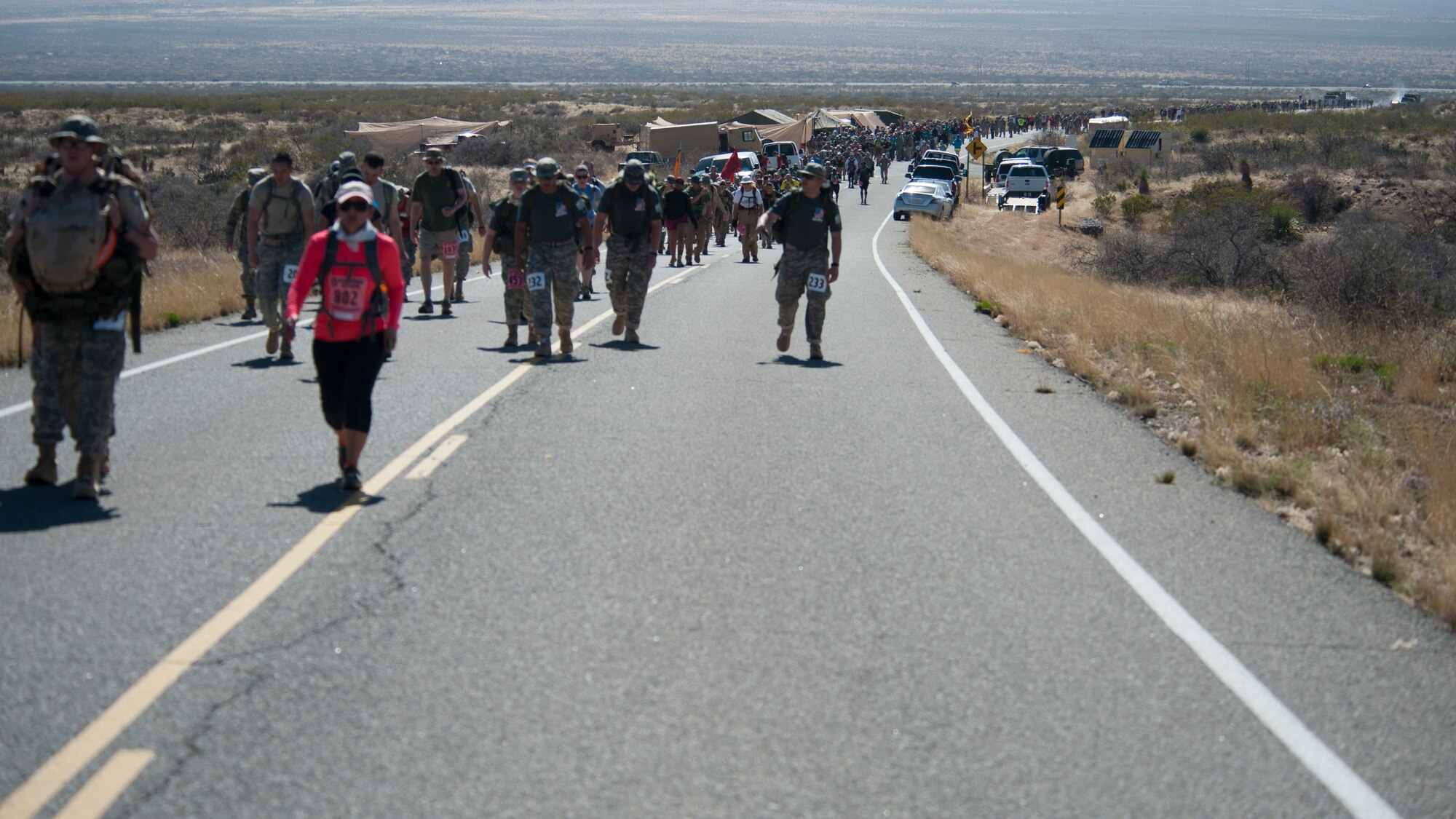 Participants in the 25th annual Bataan Memorial Death march make their way through the course at White Sands Missile Range, N.M., March 23. Over 6,200 participants came to honor more than 76,000 Prisoners of War and Missing in Action from Bataan and Corregidor during World War II. The 26.2-mile course starts on WSMR, enters hilly terrain and finishes through sandy desert trails, with elevation ranging from 4,100 to 5,300 feet. (U.S. Air Force photo by Airman 1st Class Aaron Montoya / Released)