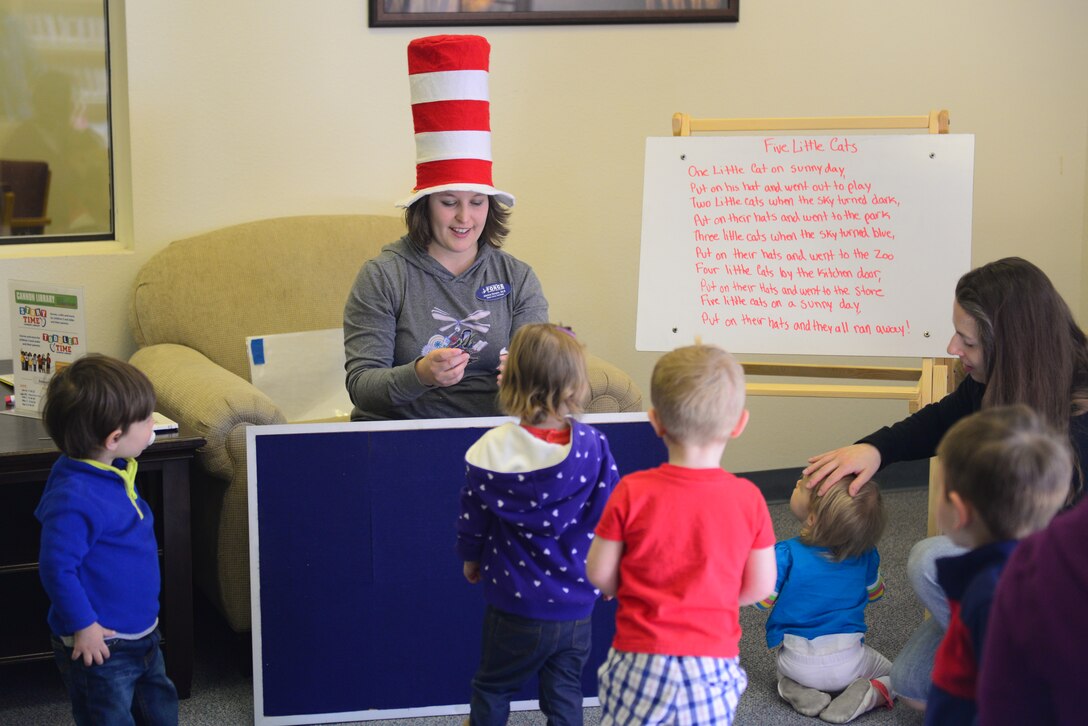 Jessica Severin, 27th Special Operations Force Support Squadron senior library technician, engages toddlers in a felt board activity during Toddler Time, March 12, 2014 at Cannon Air Force Base, N.M. Toddler Time mixes stories, activities and crafts to entertain and educate Cannon’s children. (U.S. Air Force Photo/Airman 1st Class Shelby Kay-Fantozzi) 