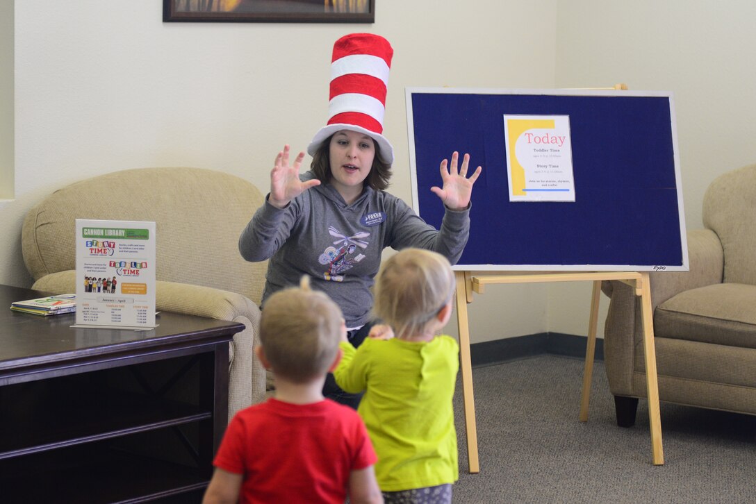 Jessica Severin, 27th Special Operations Force Support Squadron senior library technician, engages toddlers in a finger game during Toddler Time, March 12, 2014 at Cannon Air Force Base, N.M. Toddler Time mixes stories, activities and crafts to entertain and educate Cannon’s children. (U.S. Air Force Photo/Airman 1st Class Shelby Kay-Fantozzi) 