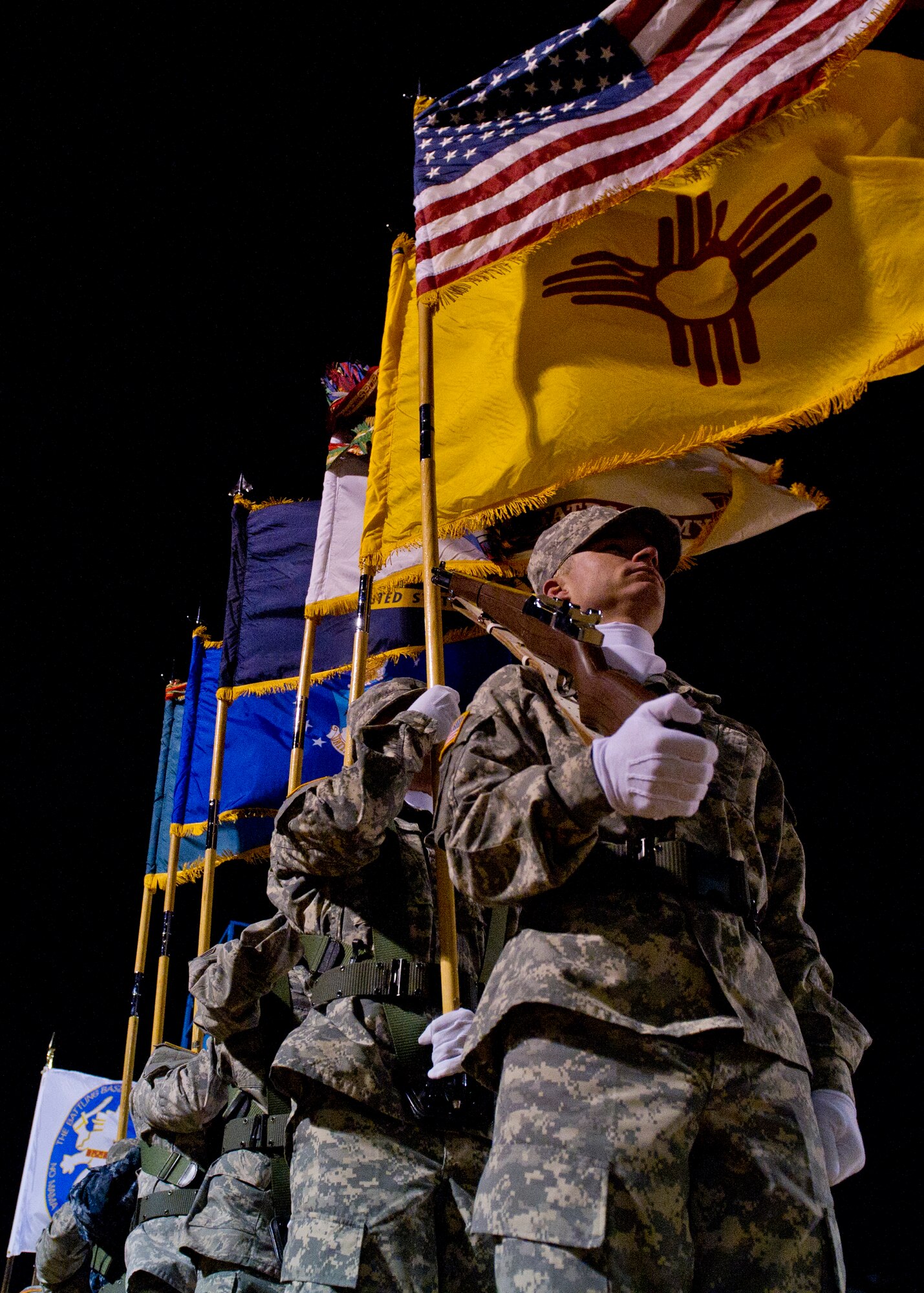 The White Sands Missile Range Honor Guard prepares to post the colors during the opening ceremony of the 25th annual Bataan Memorial Death March at White Sands Missile Range, N.M., March 23. Over 6,200 participants came to honor more than 76,000 Prisoners of War and Missing in Action from Bataan and Corregidor during World War II. The 26.2-mile course starts on WSMR, enters hilly terrain and finishes through sandy desert trails, with elevation ranging from 4,100 to 5,300 feet. (U.S. Air Force photo by Airman 1st Class Chase Cannon / Released)