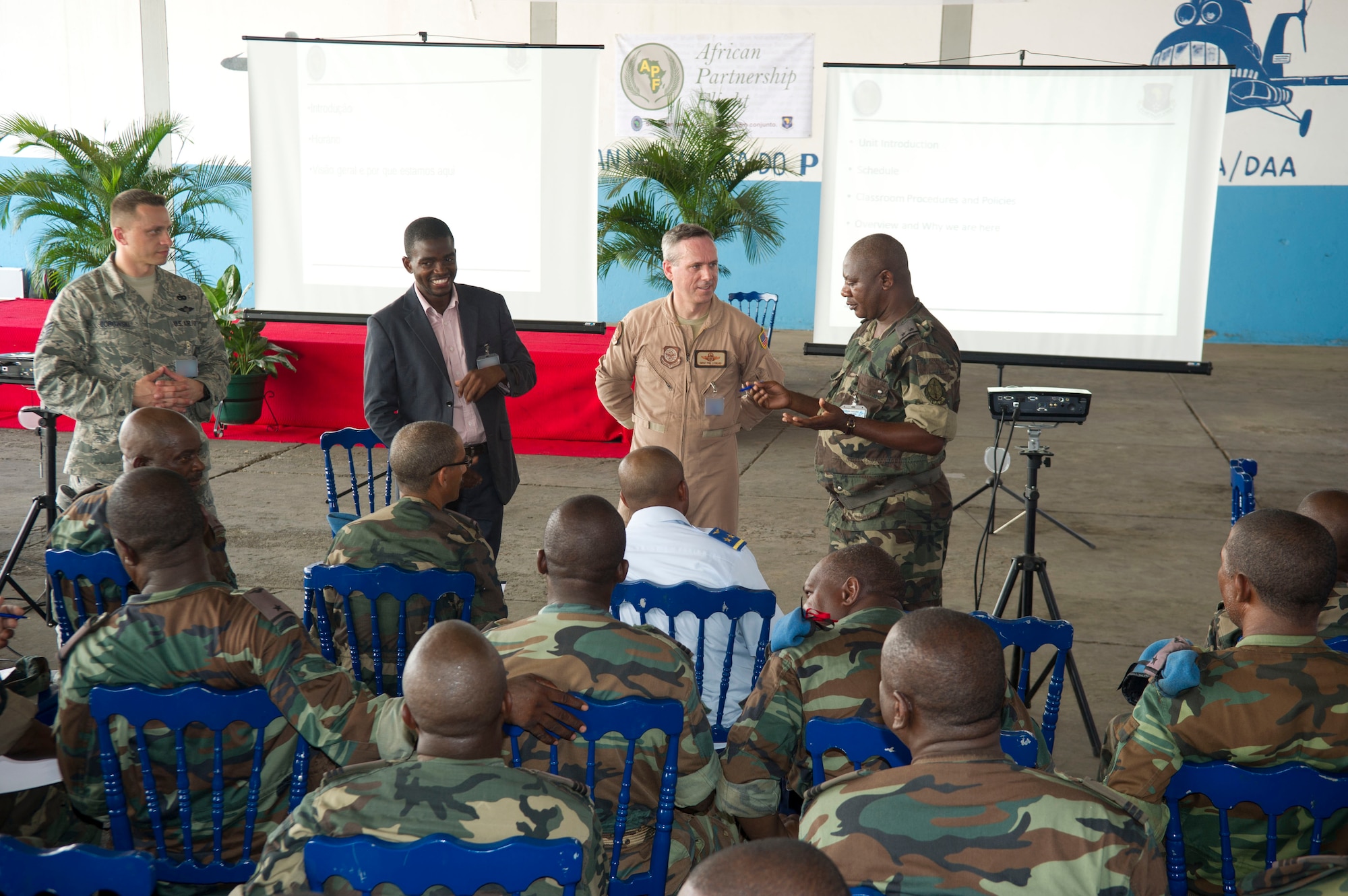 Members of African Partnership Flight Angola 2014 participate in a discussion on cargo build up on Luanda Air Base, Angola, March 24, 2014. The intention of APF is to strengthen the regional partnerships within Africa by improving the proficiency and readiness of key mission areas through a collaborative learning environment. (U.S. Air Force photo/Tech. Sgt. Benjamin Wilson)(Released)