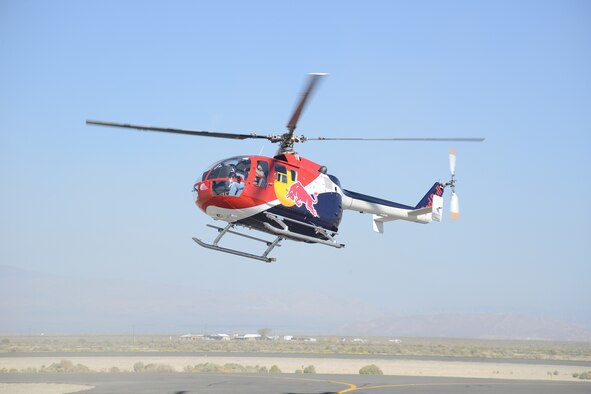 The Red Bull helicopter performed along with the company's plane aerobatics stunt plane. (U.S. Air Force photo by Kenji Thuloweit)