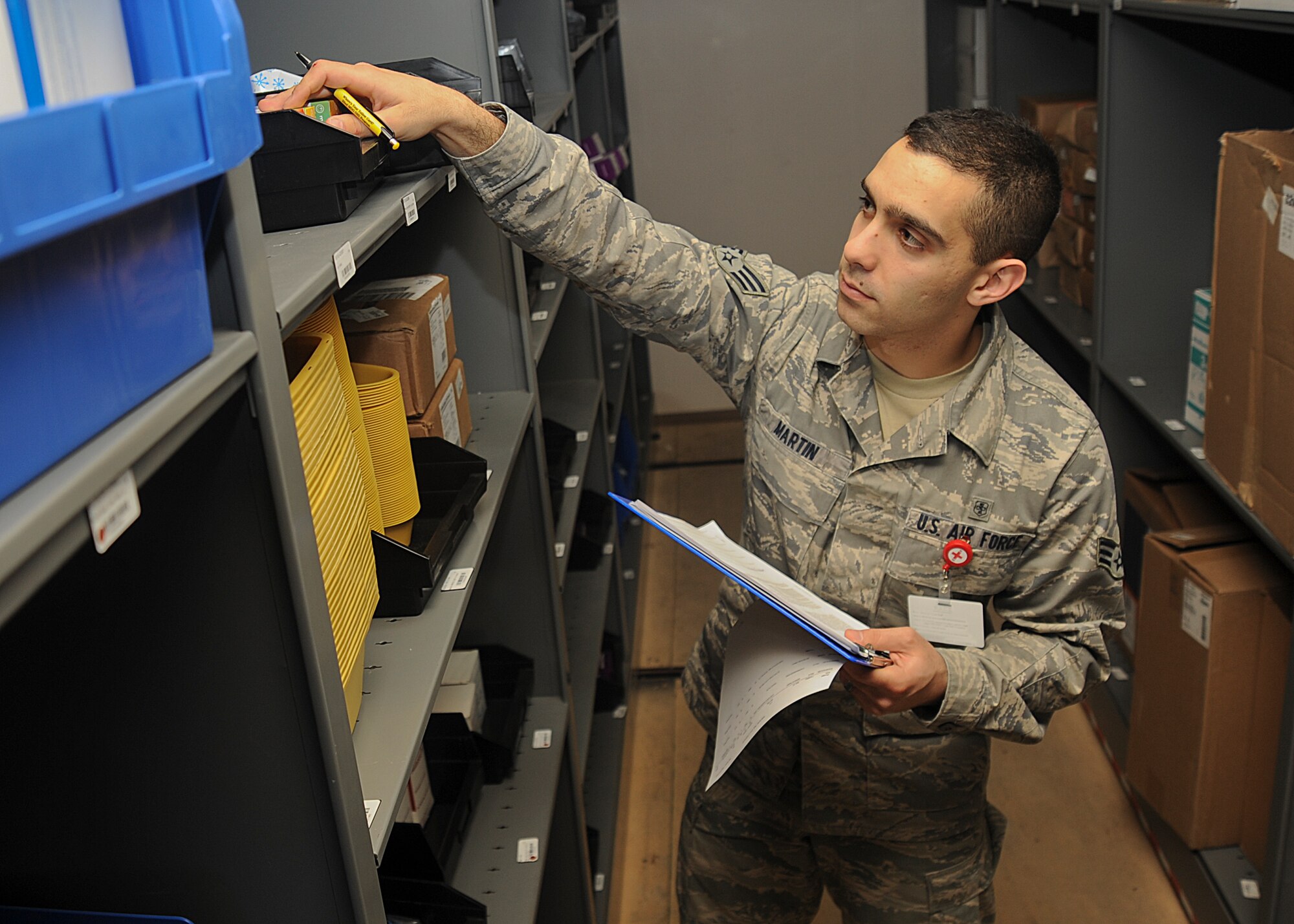 Senior Airman Joshua Martin, 22nd Medical Support Squadron medical materiel technician, performs an inventory check, March 17, 2014, at McConnell Air Force Base, Kan. Martin is part of a team that is responsible for more than $3 million of supplies and equipment for the 22nd Medical Group. (U.S. Air Force photo/Senior Airman Maurice A. Hodges)