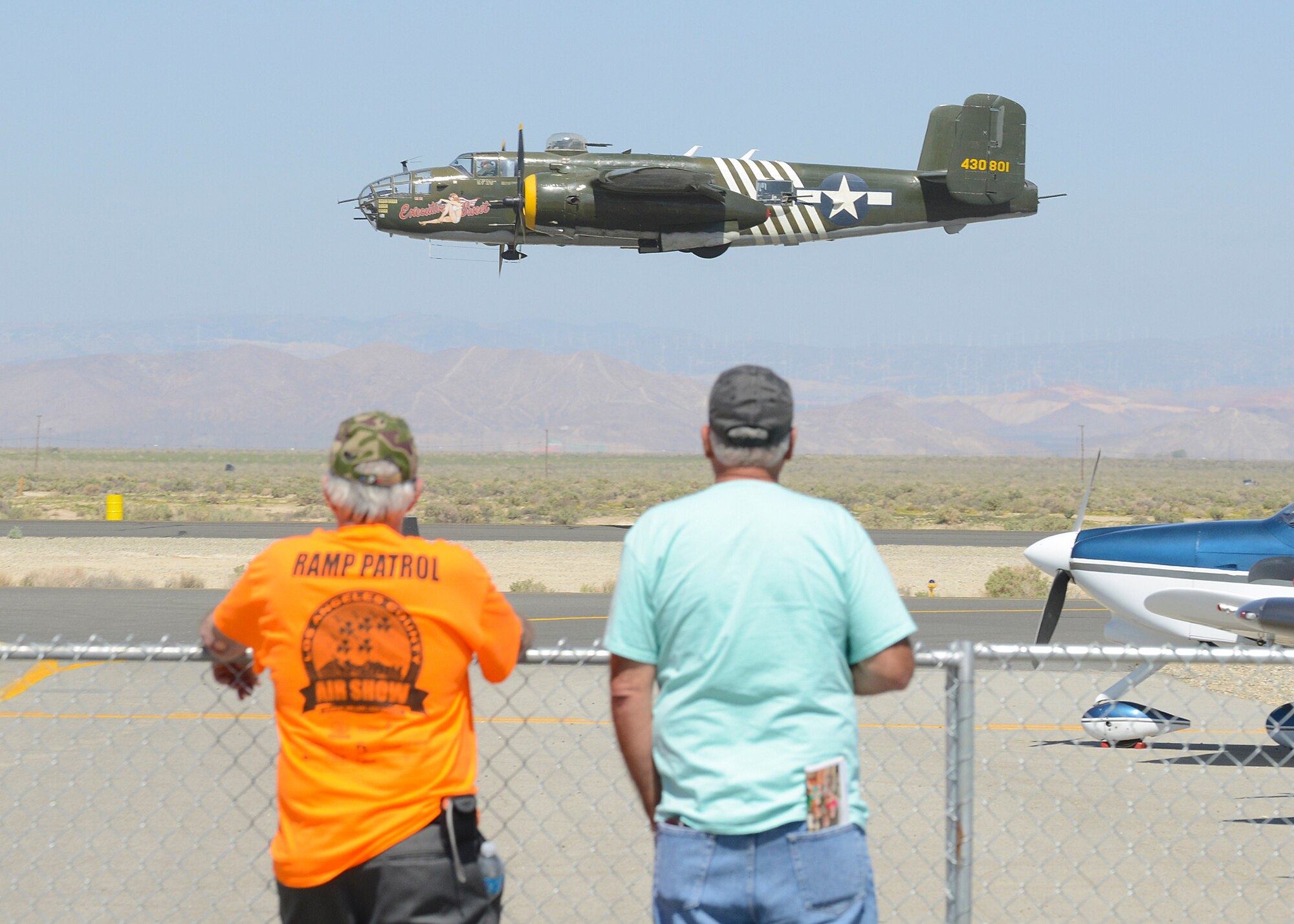 The American Aeronautical Foundation's B-25 Mitchell bomber demonstrated bomb runs that made the plane famous in World War II. The "Executive Sweet" B-25 is armed with 13 machine guns and can carry up to 6,000 lbs of ordnance. Before and after flights, the B-25 was available for tours to the crowd. (U.S. Air Force photo by Kenji Thuloweit)