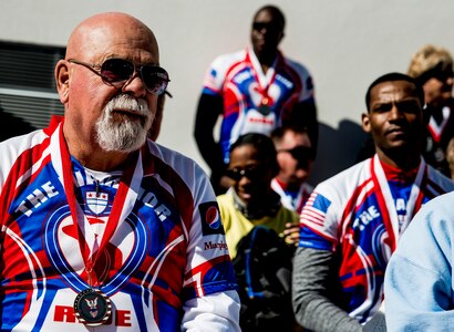 Bob Racine, Warrior Ride cyclist, and other members of the Warrior Ride group wear medals presented from the Military Magnet Academy in North Charleston, S.C., during the Warrior Ride March 21, 2014. Warrior Ride is a non-profit organization that uses adaptive bicycling and other morale building events, such as kayaking and golf, as a tool for recreation and rehabilitation for our injured war heroes. (U.S. Air Force photo/ Senior Airman Dennis Sloan)