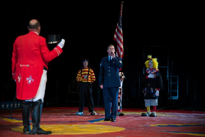 Staff Sgt. Timothy Womble, 437th Maintenance Squadron, sings the National Anthem March 21, 2014, at the Cole Bros. Circus of the Stars in Ladson, S.C. The Cole Bros. Circus began in 1884, and is known as the “World's Largest Circus Under the Big Top.” (U.S. Air Force photo/Senior Airman Ashlee Galloway)