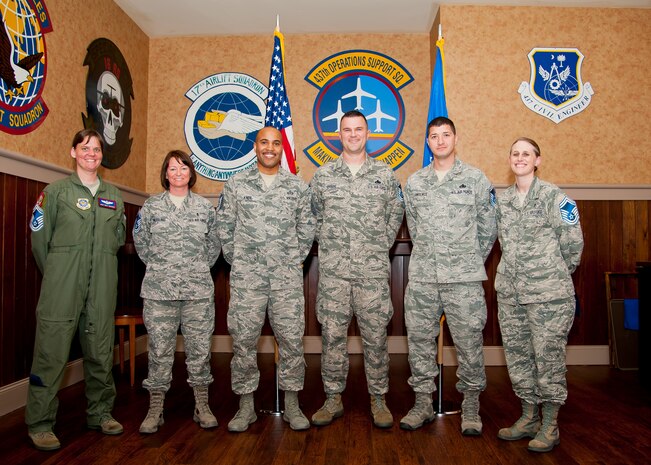 Joint Base Charleston’s newest chief master sergeants celebrate March 20, 2014, during the Senior Master Sergeant Release Party at the Charleston Club on Joint Base Charleston – Air Base, S.C. From left to right, Master Sgt. Emily Edmunds, 15th Airlift Squadron, Master Sgt. Crystal Kiessling, 628th Aerospace Medical Squadron, Master Sgt. James Knox, 437th Operation Support Squadron, Master Sgt. Christopher Greene, 437th Maintenance  Squadron, Master Sgt. Joseph Lawrence,437th MXS and Master Sgt. Kari Boyles, 628th Aerospace Medical Squadron. (U.S. Air Force photo/Staff Sgt. William O’Brien)