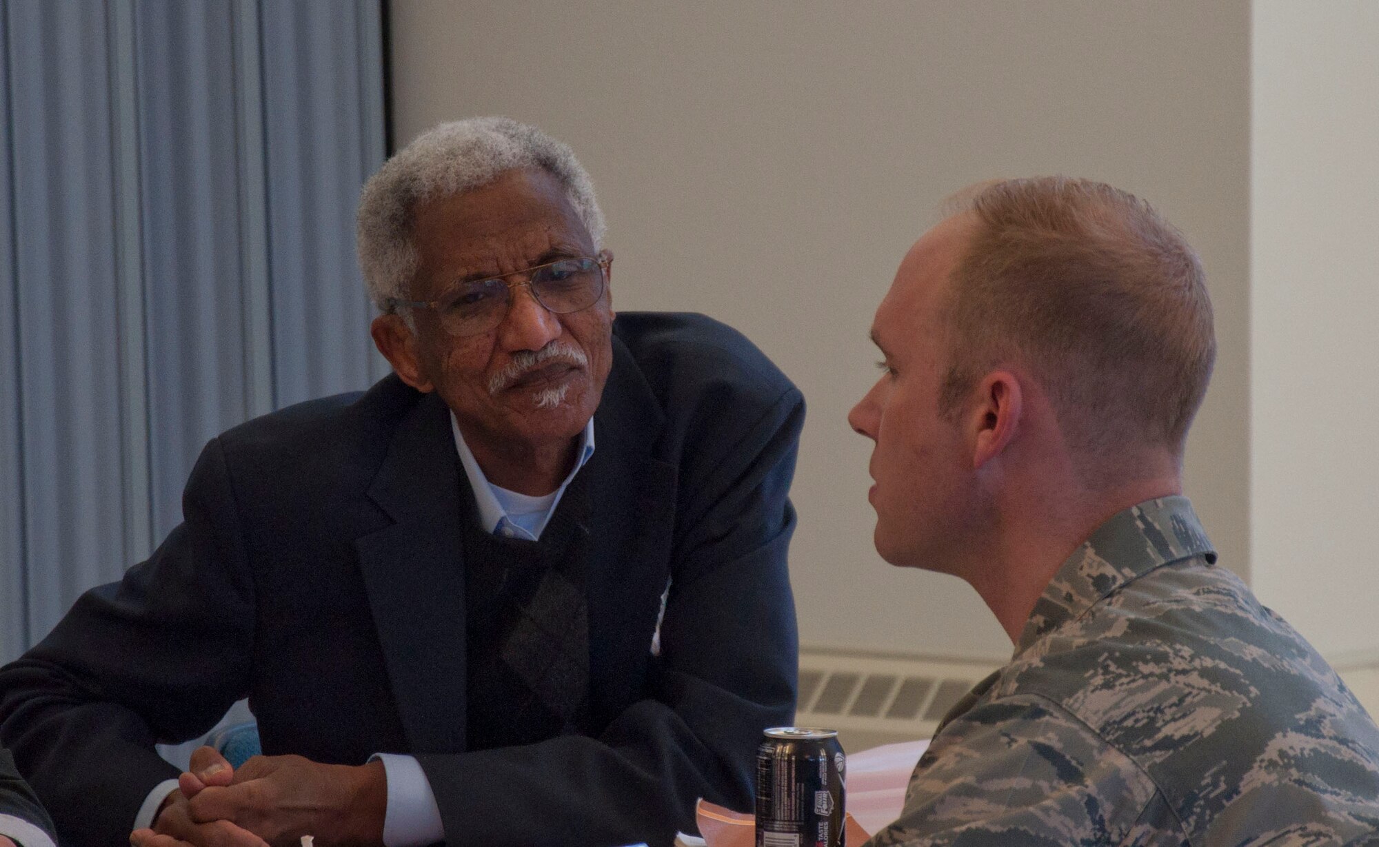 Imam Mohamed Salih, Southeast Wyoming Islamic Center, talks with Chaplain (Capt.) Samuel McClellan, 90th Operations Group chaplain, March 19 during the lunch portion of the chapel’s Clergy Appreciation Day. Eighteen clergy members from the local Cheyenne area joined the Warren chaplain team during the appreciation event. (U.S. Air Force photo by Airman 1st Class Brandon Valle)