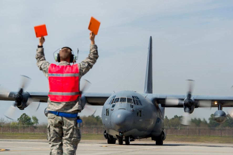 U.S. Air Force Senior Airman Moises Rodriguez, 723d Aircraft Maintenance Unit crew chief, marshals HC-130P Combat King, tail number 64-4860, as it prepares for deployment departure March 21, 2014, at Moody Air Force Base, Ga. The aircraft, along with another Combat King, tail number 65-0982, will support efforts in Air Forces Africa in what is planned to be the final deployment for active-duty HC-130Ps as the Air Force transitions to the HC-130J Combat King II. (U.S. Air Force photo by Staff Sgt. Jamal D. Sutter/Released) 