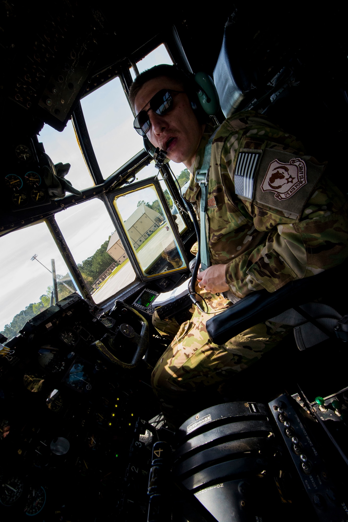 U.S. Air Force Capt. Luke Sandbeck, 71st Rescue Squadron HC-130P Combat King pilot, conducts pre-flight checks in HC-130P, tail number 65-0982, before departing for his first deployment March 21, 2014, at Moody Air Force Base, Ga. Sandbeck co-piloted the aircraft on its journey in what is planned to be the final deployment for active-duty HC-130Ps as the Air Force transitions to the HC-130J Combat King II. (U.S. Air Force photo by Staff Sgt. Jamal D. Sutter/Released)