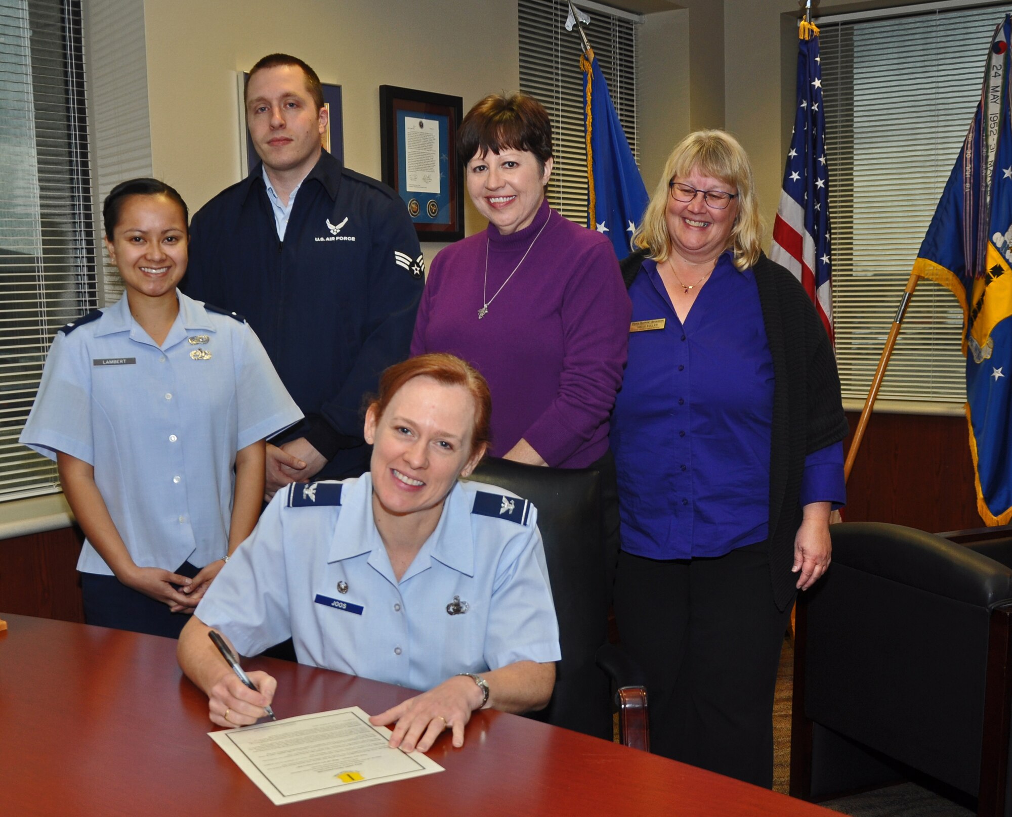 GOODFELLOW AIR FORCE BASE, Texas – (left) 1st Lt. Glenna Lambert, 17th Training Wing Sexual Assault Prevention and Response Deputy Chief, Senior Airman Eric A. Meshako, Alcohol and Drug Abuse Prevention and Treatment Program and Family Advocacy technician, Lori Matus, 17th TRW SAPR specialist, and Sally Fuller 17th Force Support Squadron Airman and Family Services Flight Chief, pose with Col. Kimberlee Joos, 17th TRW Commander, for the April 2014 Joint Proclamation signing in the Norma Brown Building here, March 24. The April proclamation marked the start of Sexual Assault Awareness Month, Month of the Military Child, Child Abuse Prevention Month and Alcohol Awareness Month. (U.S. Air Force photo/ Airman 1st Class Breonna Veal)