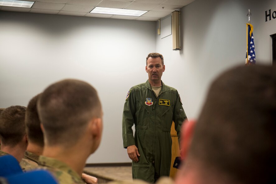 U.S. Air Force Col. Chad Franks, 23d Wing commander, gives farewell remarks to 33 Airmen before their deployment departure March 21, 2014, at Moody Air Force Base, Ga. Franks reminded the Airmen to stay vigilant and not let things become too routine downrange. (U.S. Air Force photo by Staff Sgt. Jamal D. Sutter/Released)  