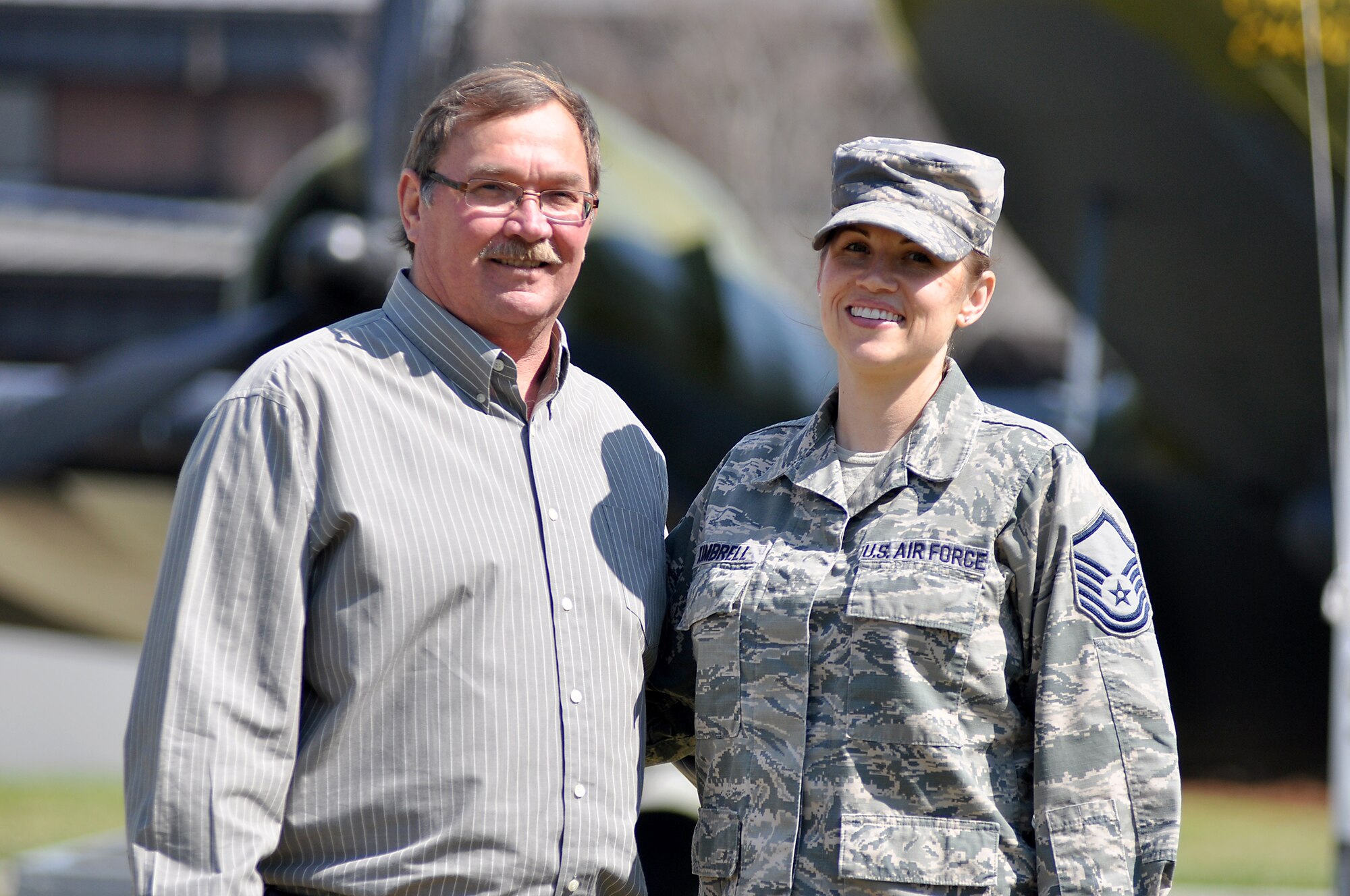 Reserve Master Sgt. Stephanie Kimbrell, logistics plans craftsman with the 315th Logistics Readiness Squadron, stands with David Harvill, public health specialist  628th Medical Group pose for a photo at Joint Base Charleston S.C.  They were complete strangers a few months ago, but now they consider each other family after Kimbrell donated one of her kidneys to Harvill who had stage 5 kidney disease. They both said they want others tobe inspired by their story and consider donating an organ to save somebody's life -- whether they are family, friends or a stranger.  (U.S. Air Force Reserve photo by Michael Dukes)